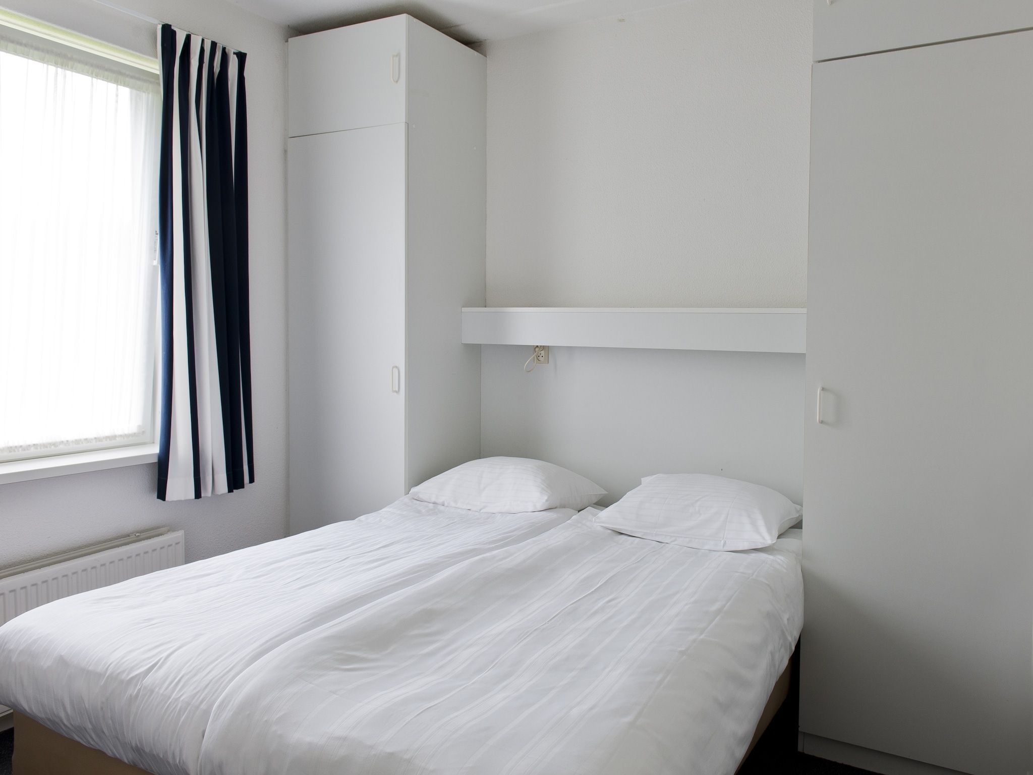 Een slaapkamer van Grand Tolve Wellness de luxe met sauna buitenspa in Earnewald