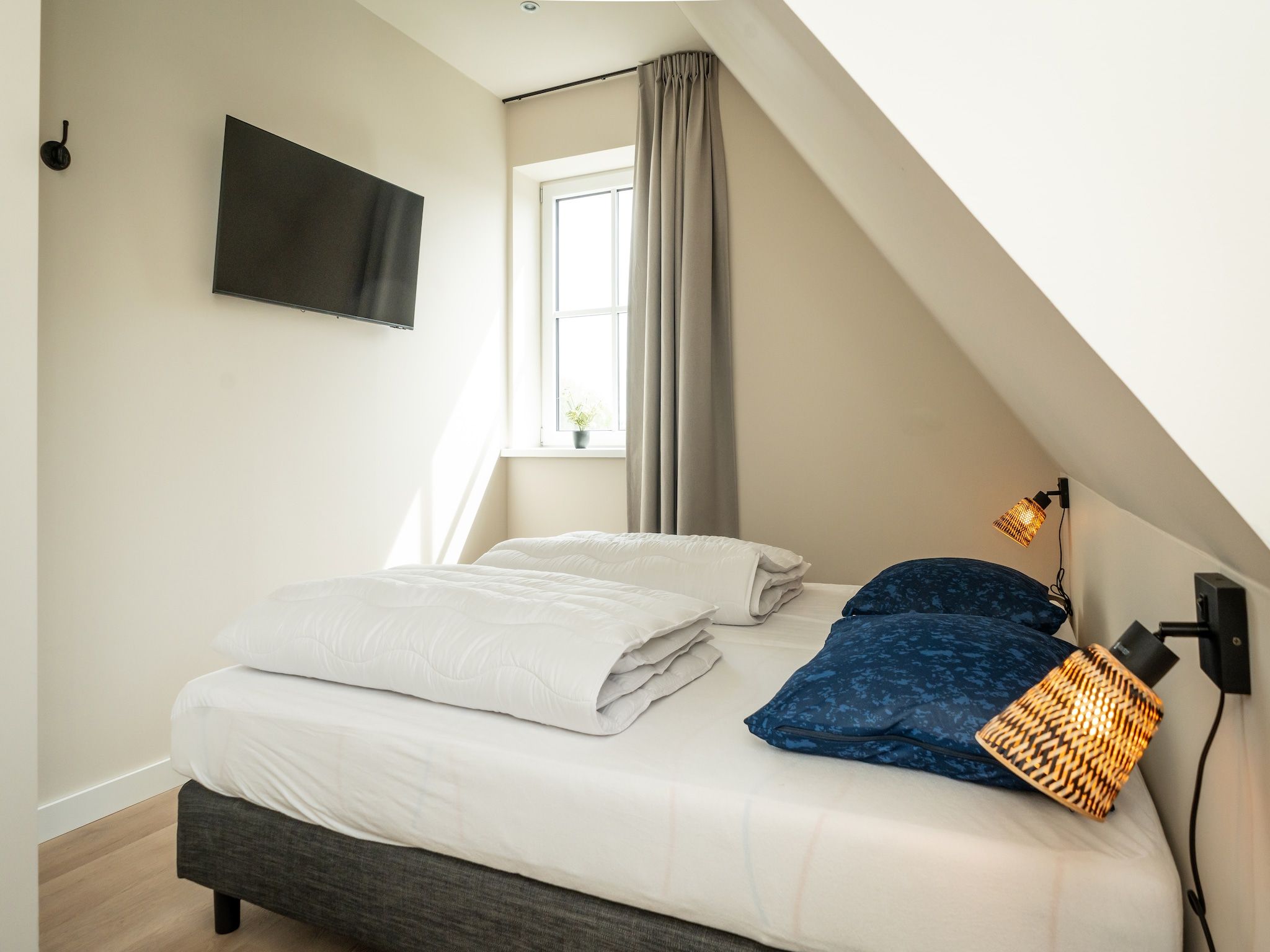 Een slaapkamer van So What 33A in De Koog
