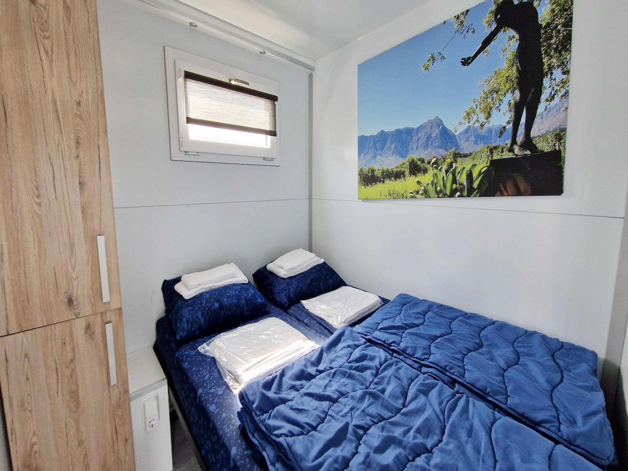 Een slaapkamer van Havenlodges Naarden 1 in Naarden