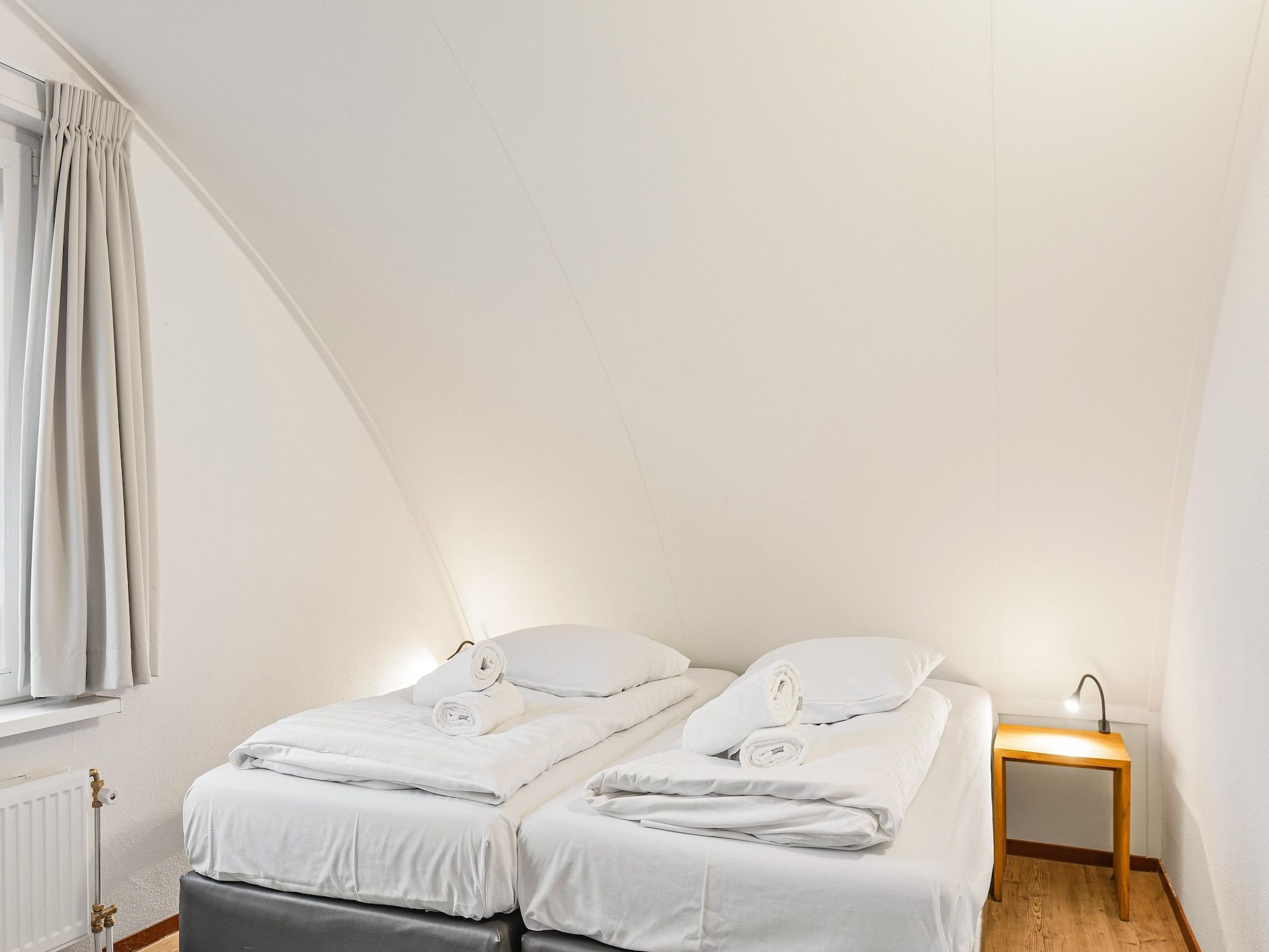 Een slaapkamer van Waterpark De Bloemert 1 in Midlaren
