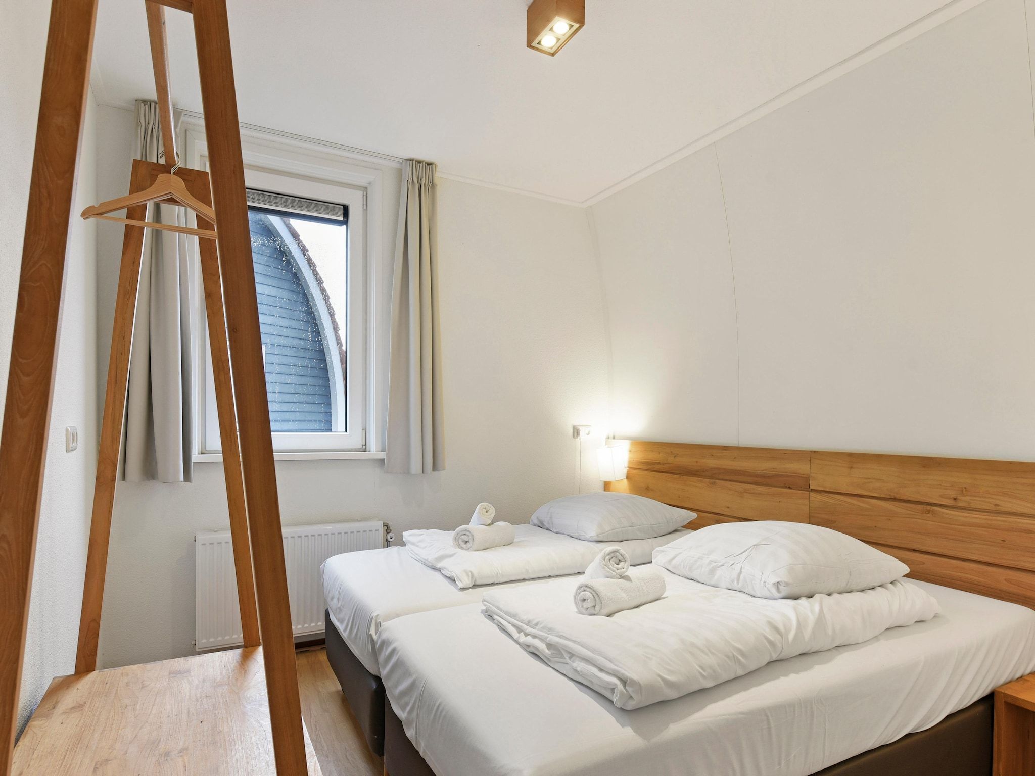 Een slaapkamer van Waterpark De Bloemert 5 in Midlaren