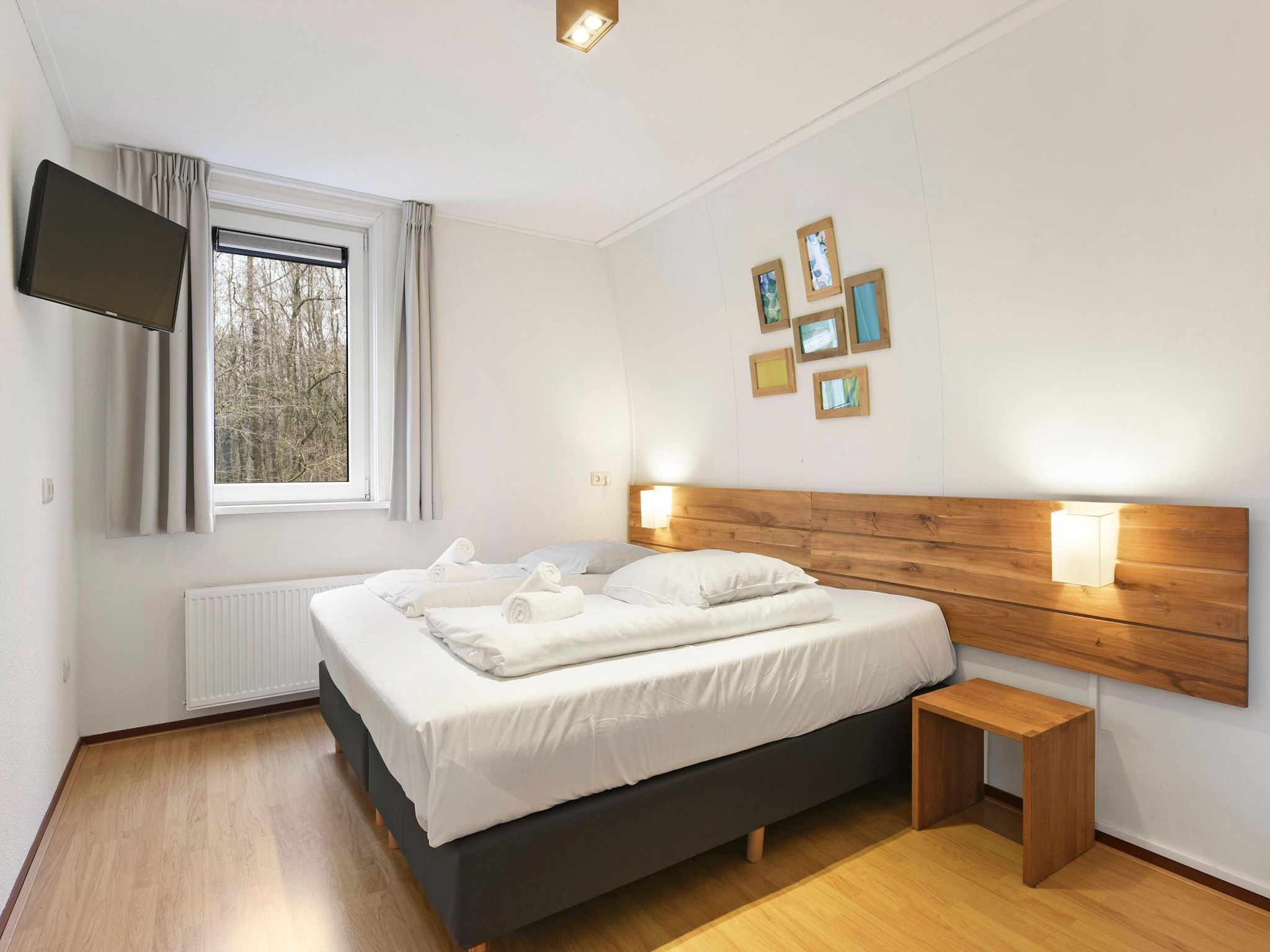Een slaapkamer van Waterpark De Bloemert 5 in Midlaren