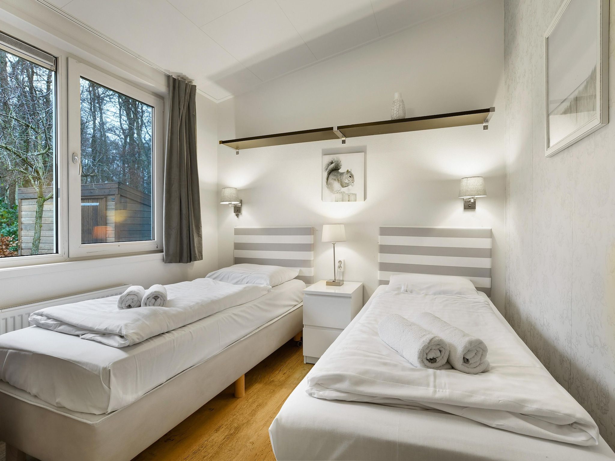 Een slaapkamer van Waterpark De Bloemert 8 in Midlaren