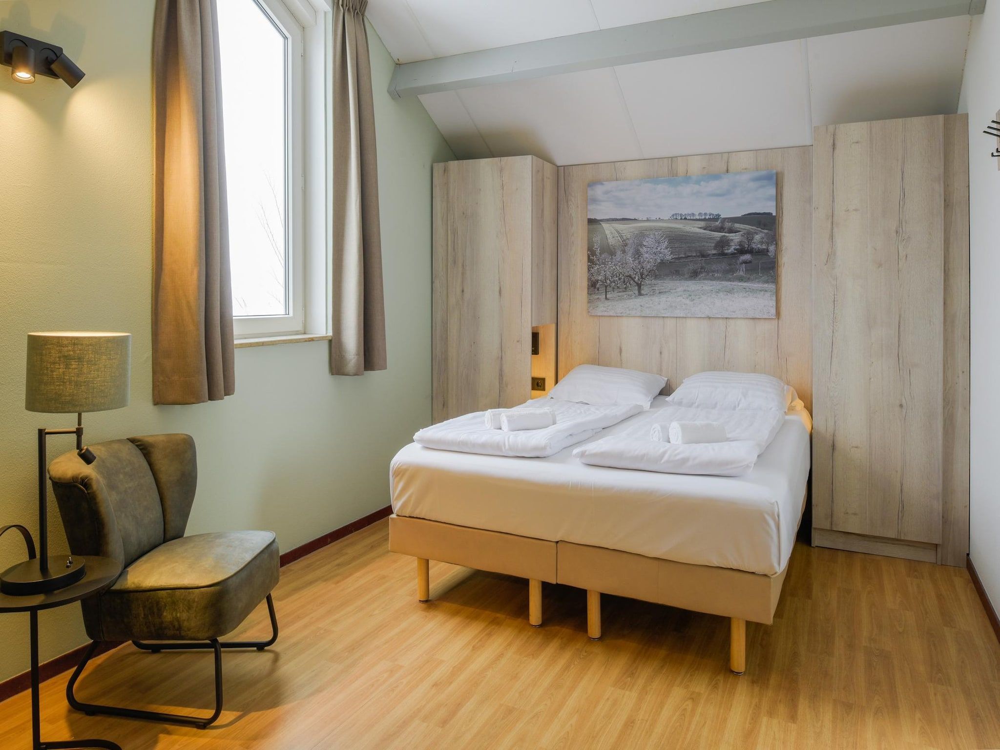 Een slaapkamer van Vakantiepark Reevallis 4 in Vijlen