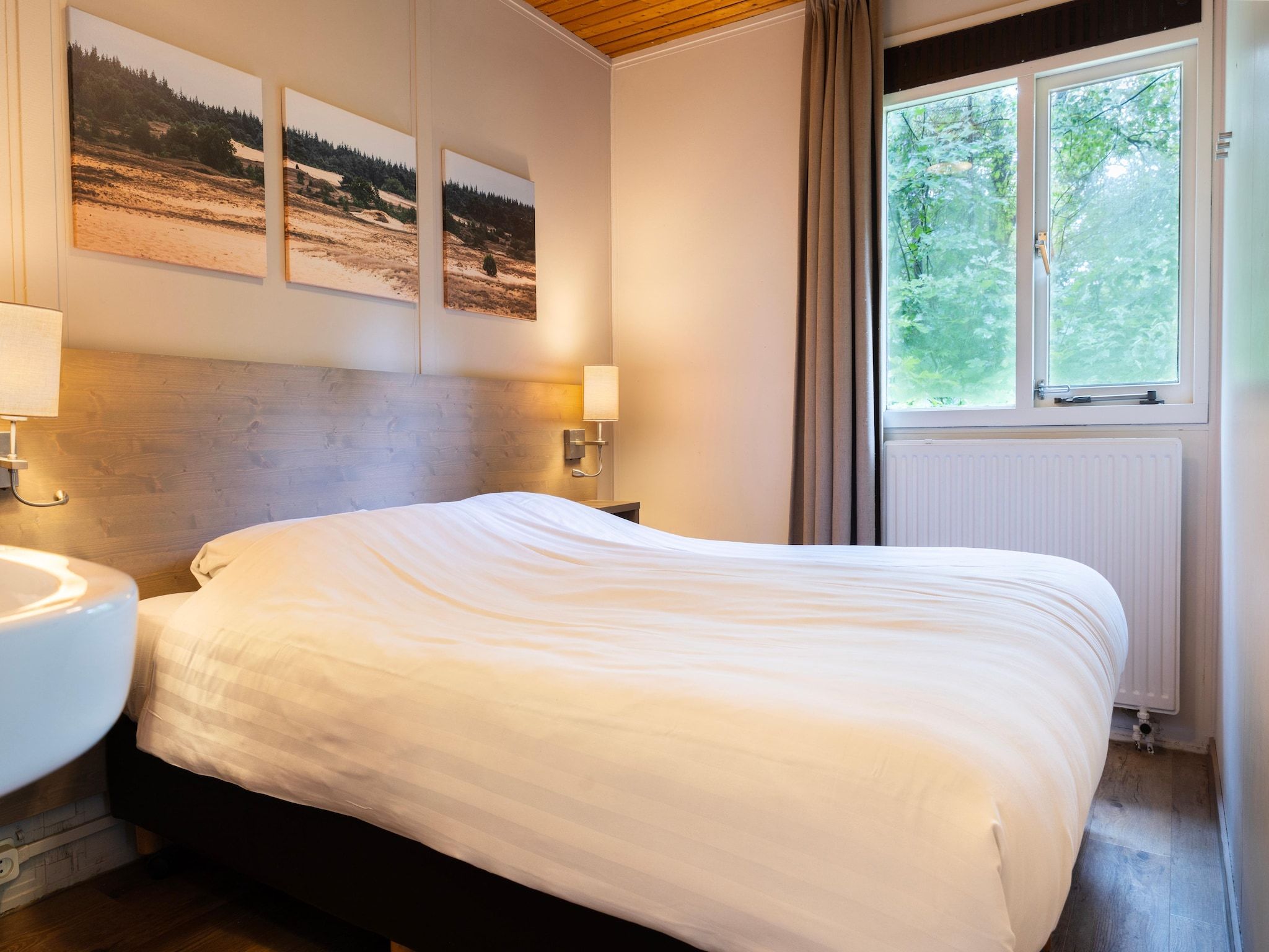 Een slaapkamer van Parc Heihaas 5 in Putten