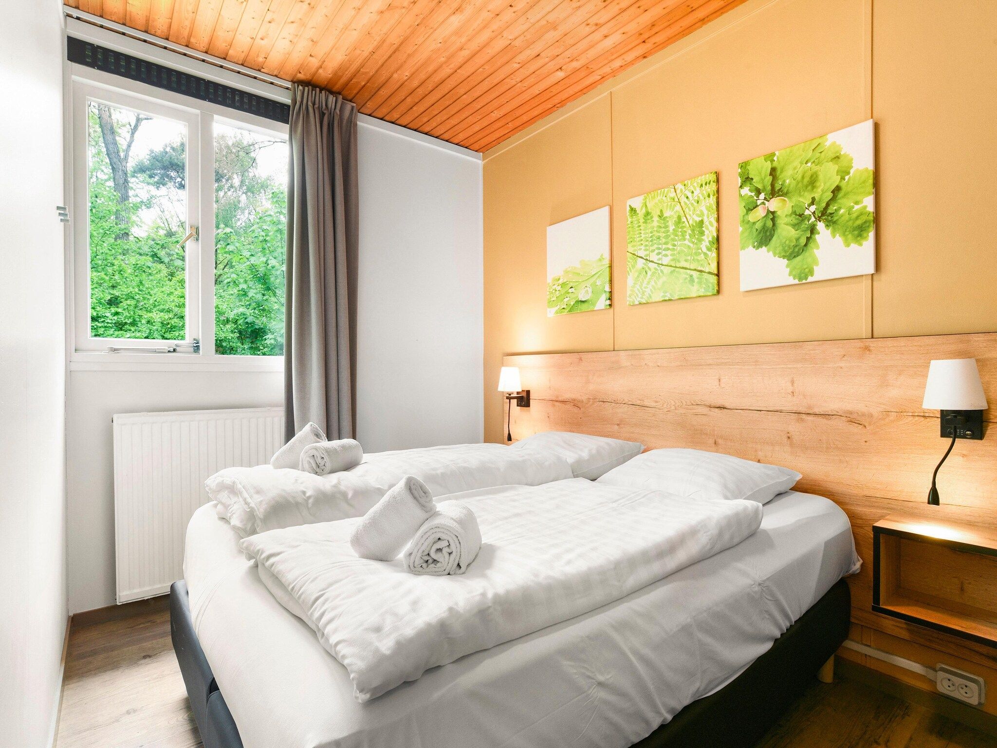 Een slaapkamer van Parc Heihaas 11 in Putten