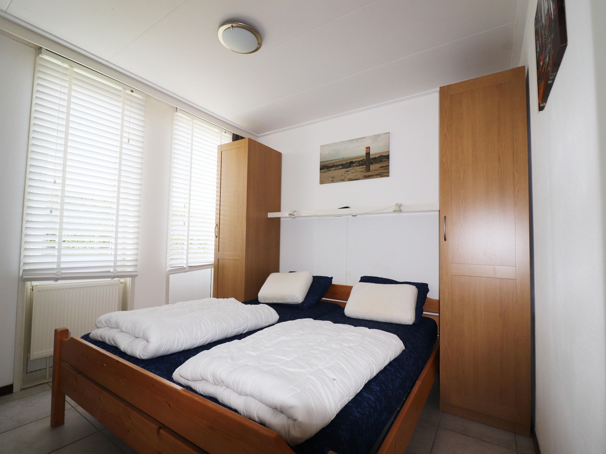 Een slaapkamer van Golfvilla 38 comfort in Hollum