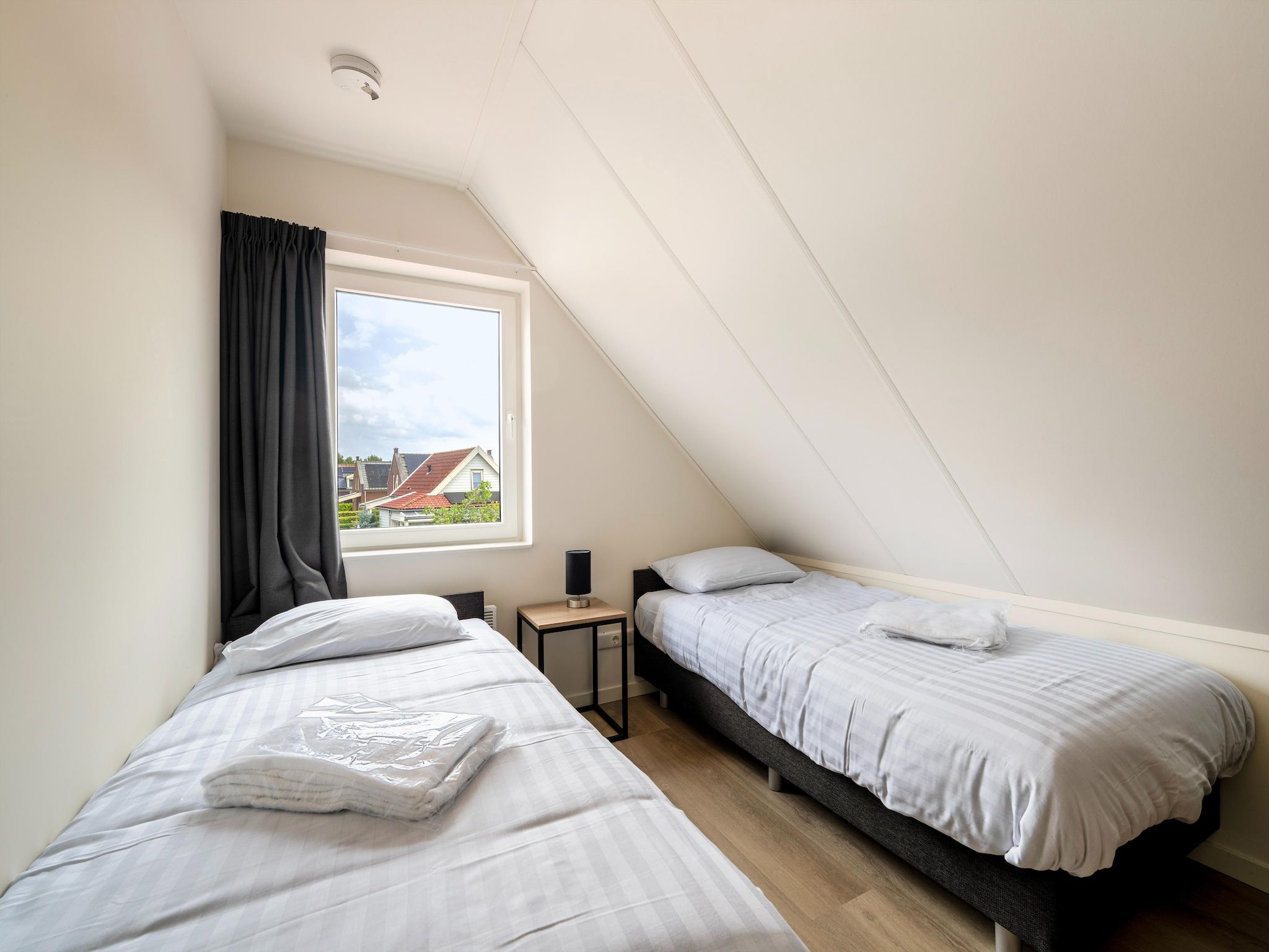 Een slaapkamer van Kuifduiker 115 in Simonshaven
