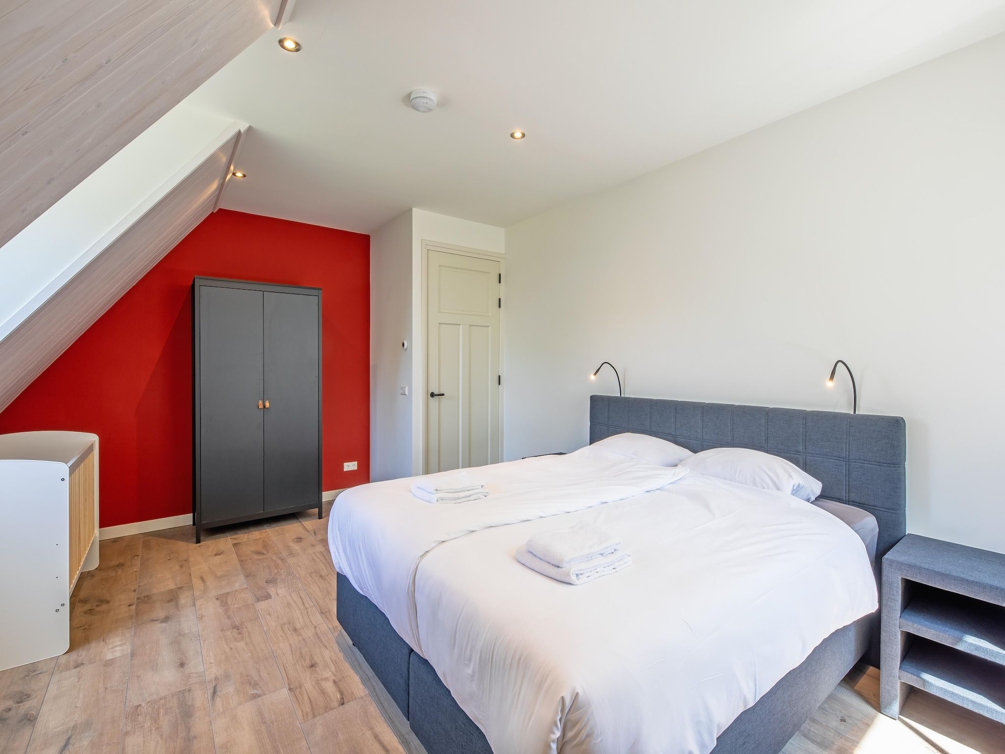 Een slaapkamer van Familievilla Nieuw-Zeeland in Oosterend