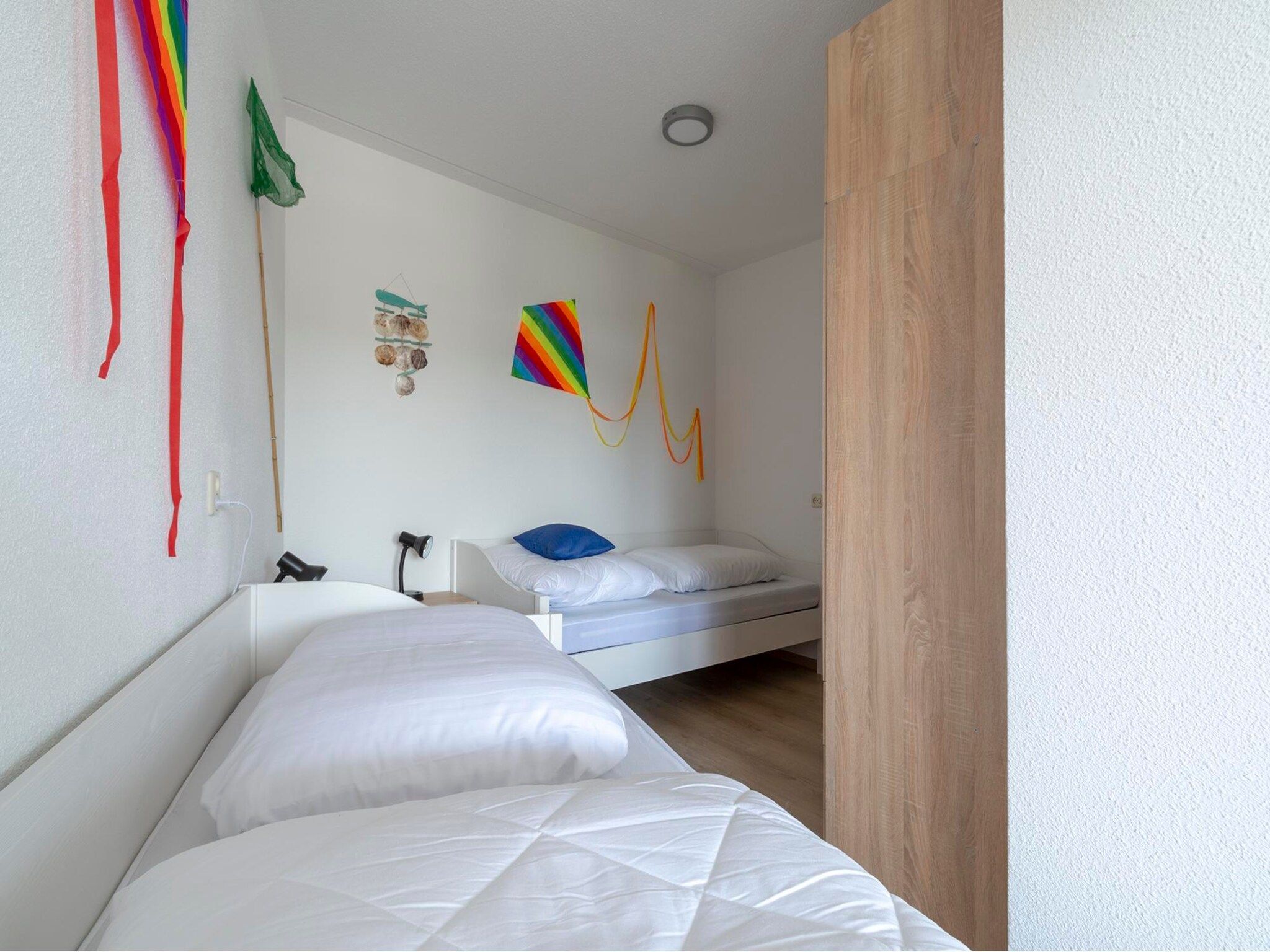 Een slaapkamer van Résidence Juliana 53 in Julianadorp aan Zee