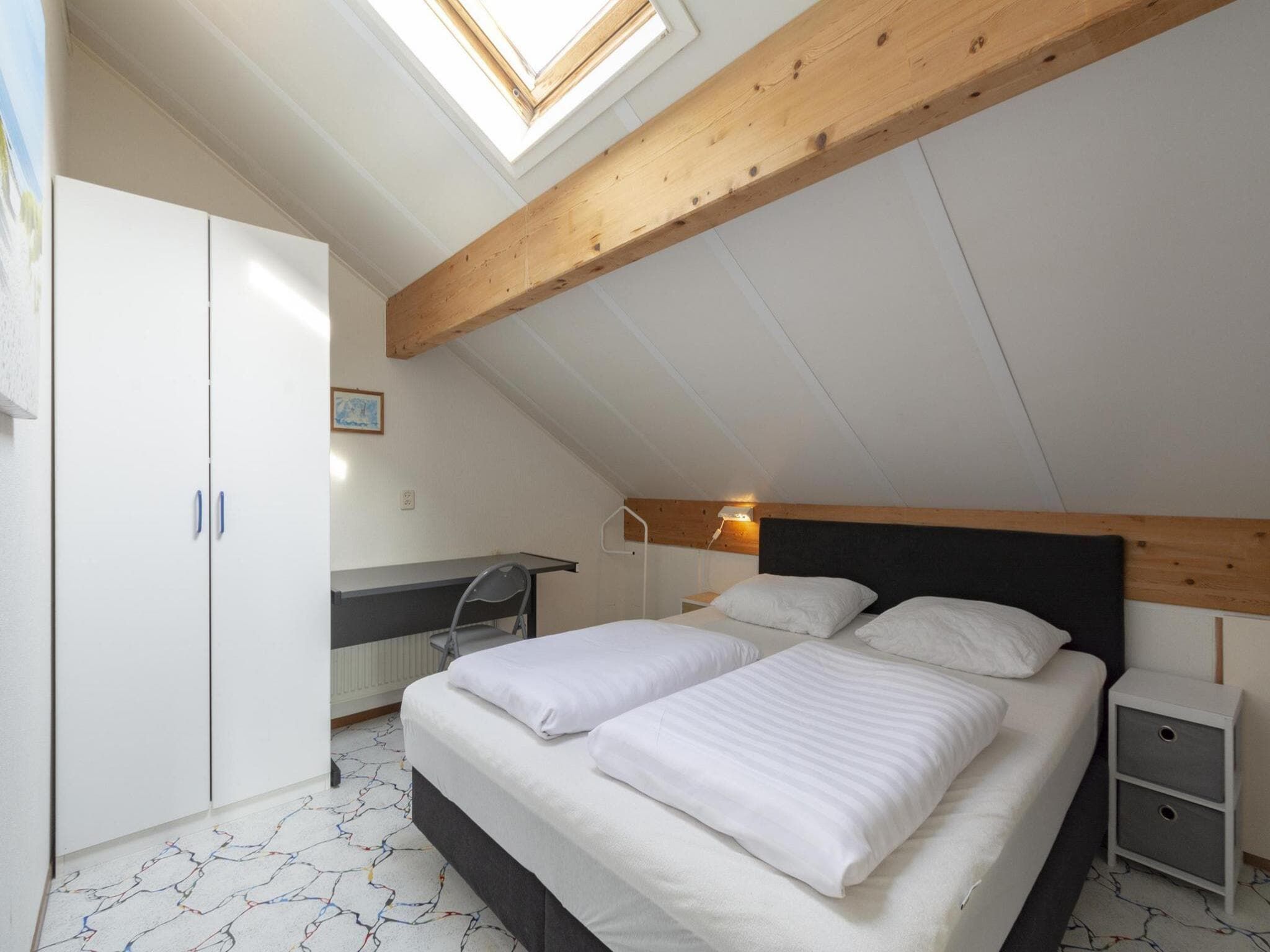 Een slaapkamer van Ooghduyne 148 in Julianadorp aan Zee