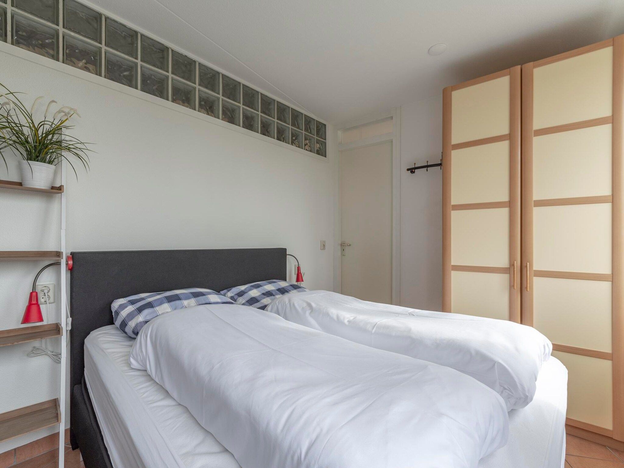 Een slaapkamer van Wijde Blick 307 in Callantsoog