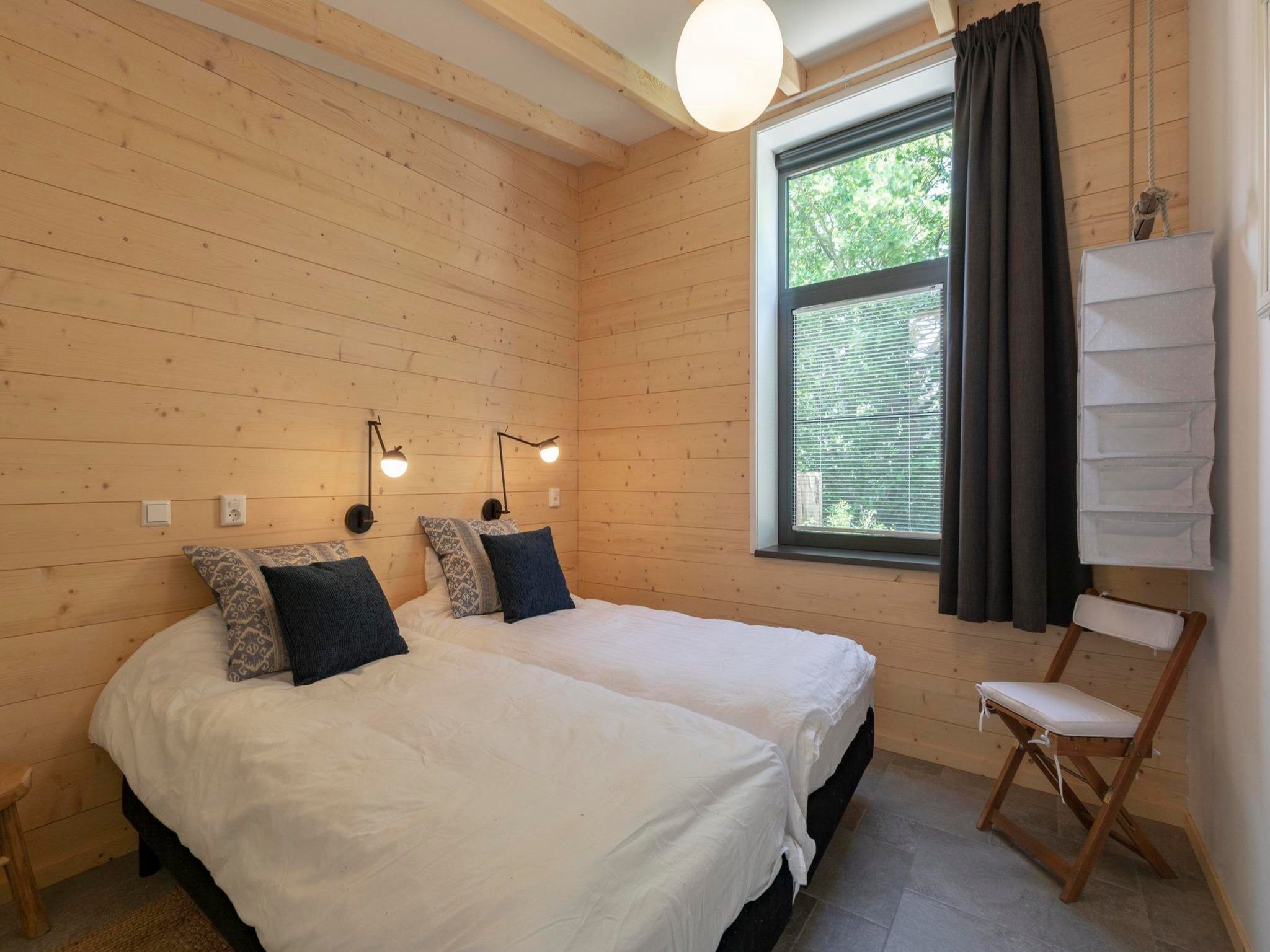 Een slaapkamer van Previnaireweg 5 in Callantsoog