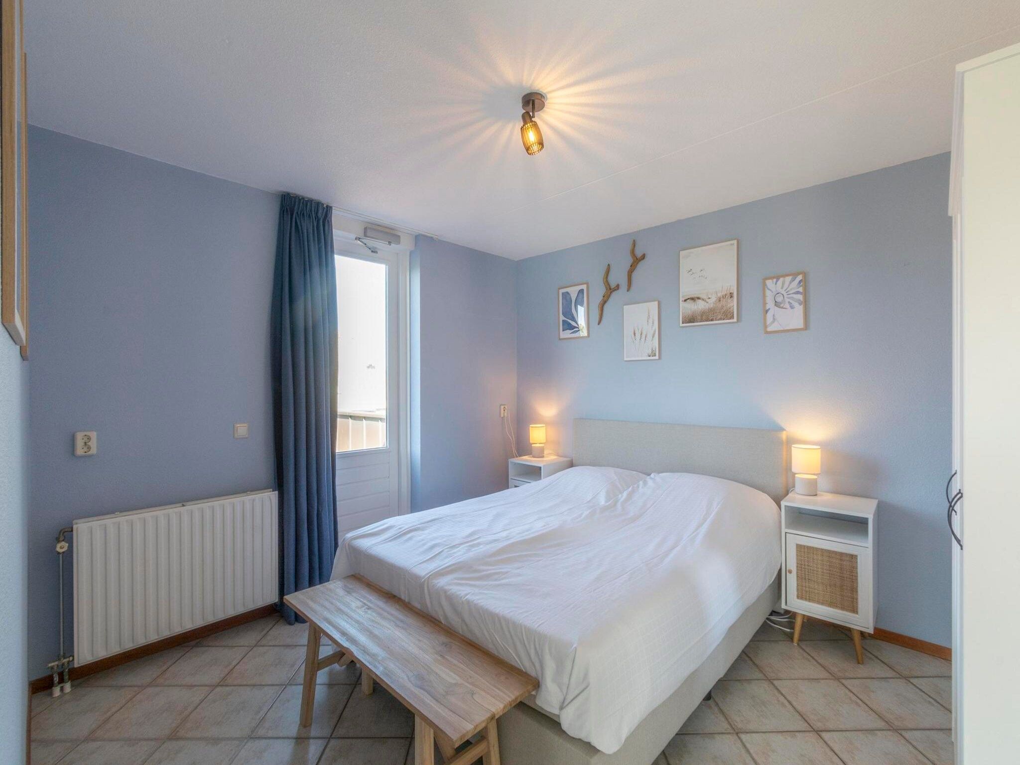 Een slaapkamer van Wijde Blick 311 in Callantsoog