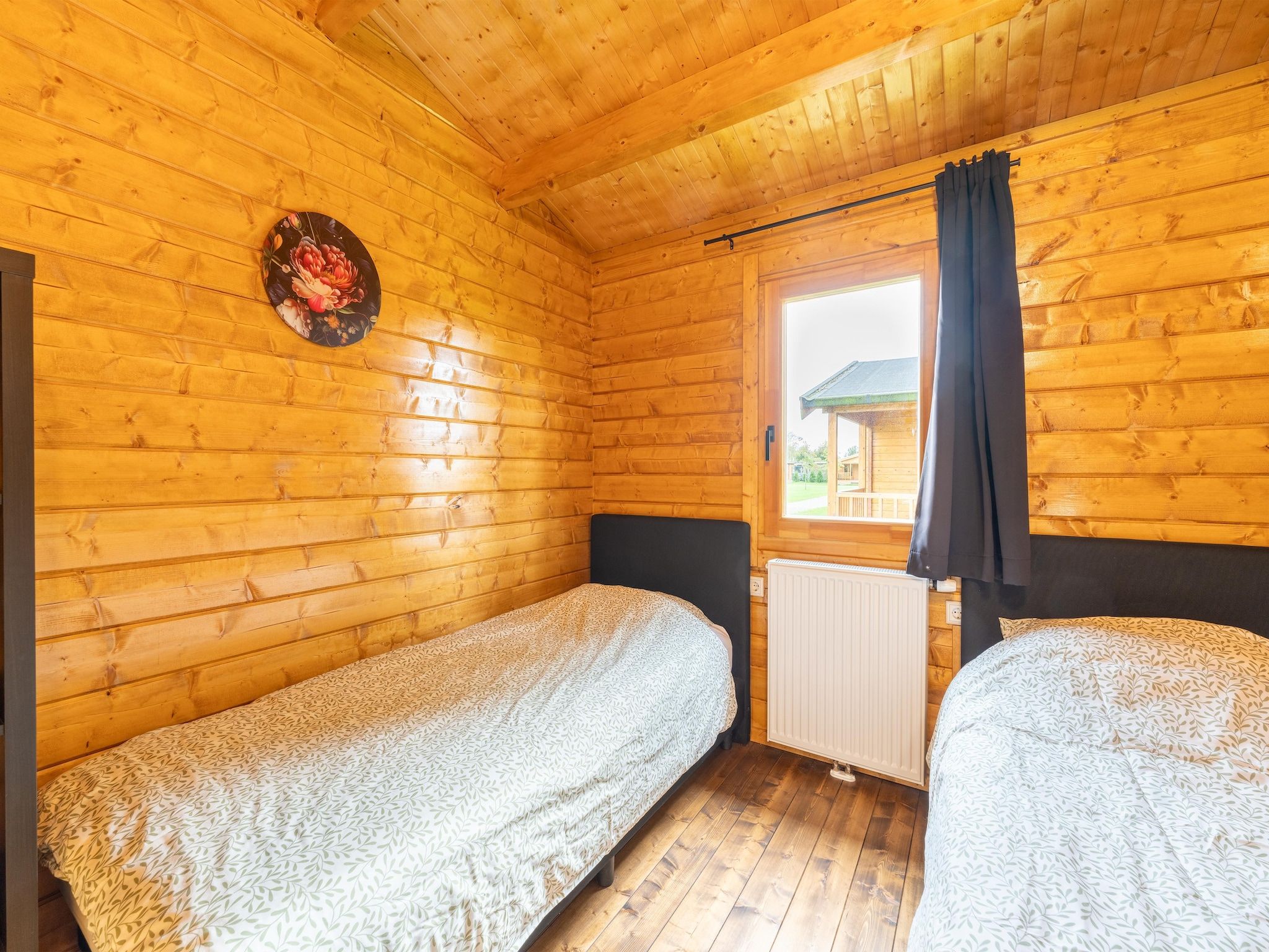 Een slaapkamer van Chalet Riga in Valkenswaard