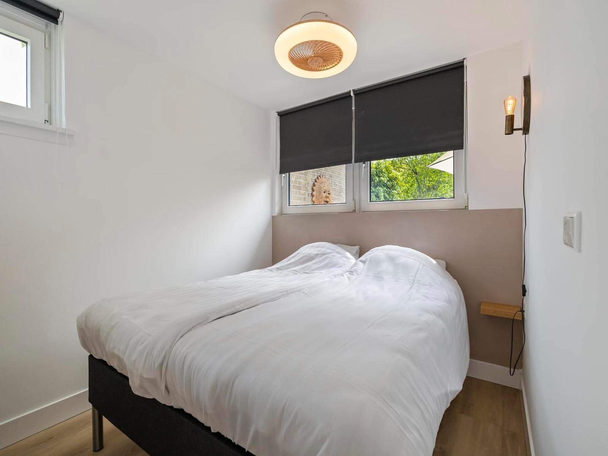 Een slaapkamer van Duinland 15 in Sint Maartenszee