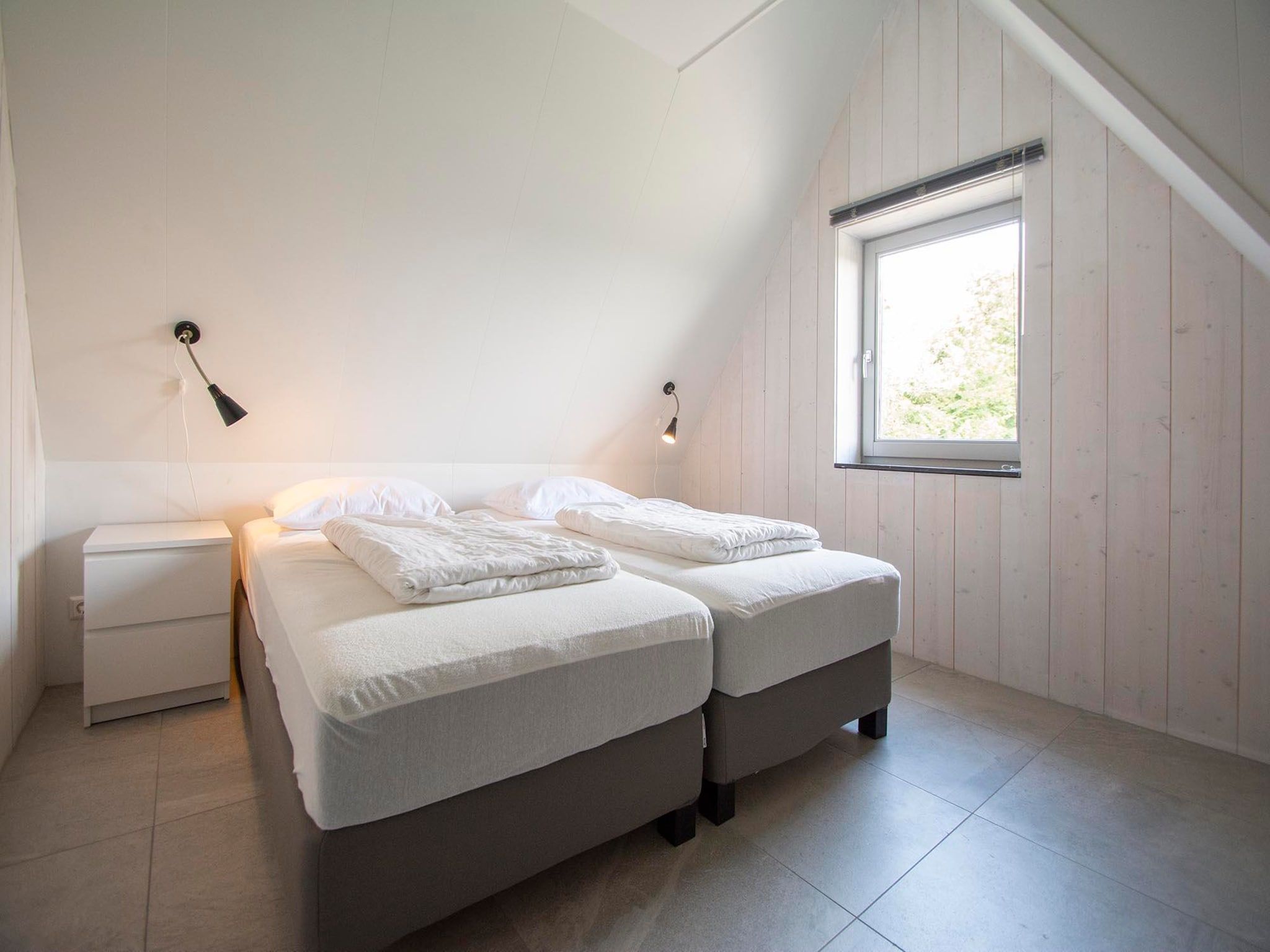 Een slaapkamer van Sandepark 171 in Callantsoog