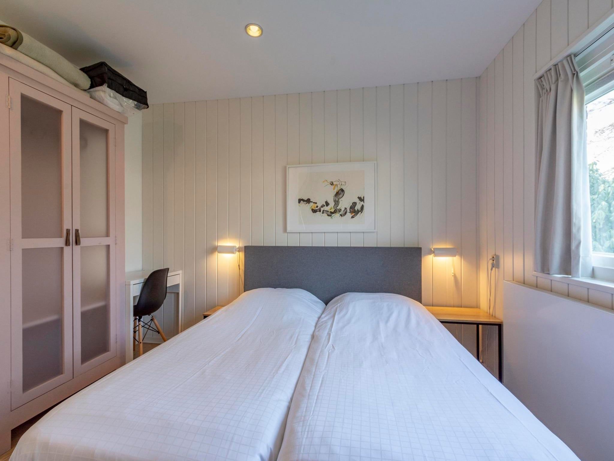 Een slaapkamer van Duinland 55 in Sint Maartenszee
