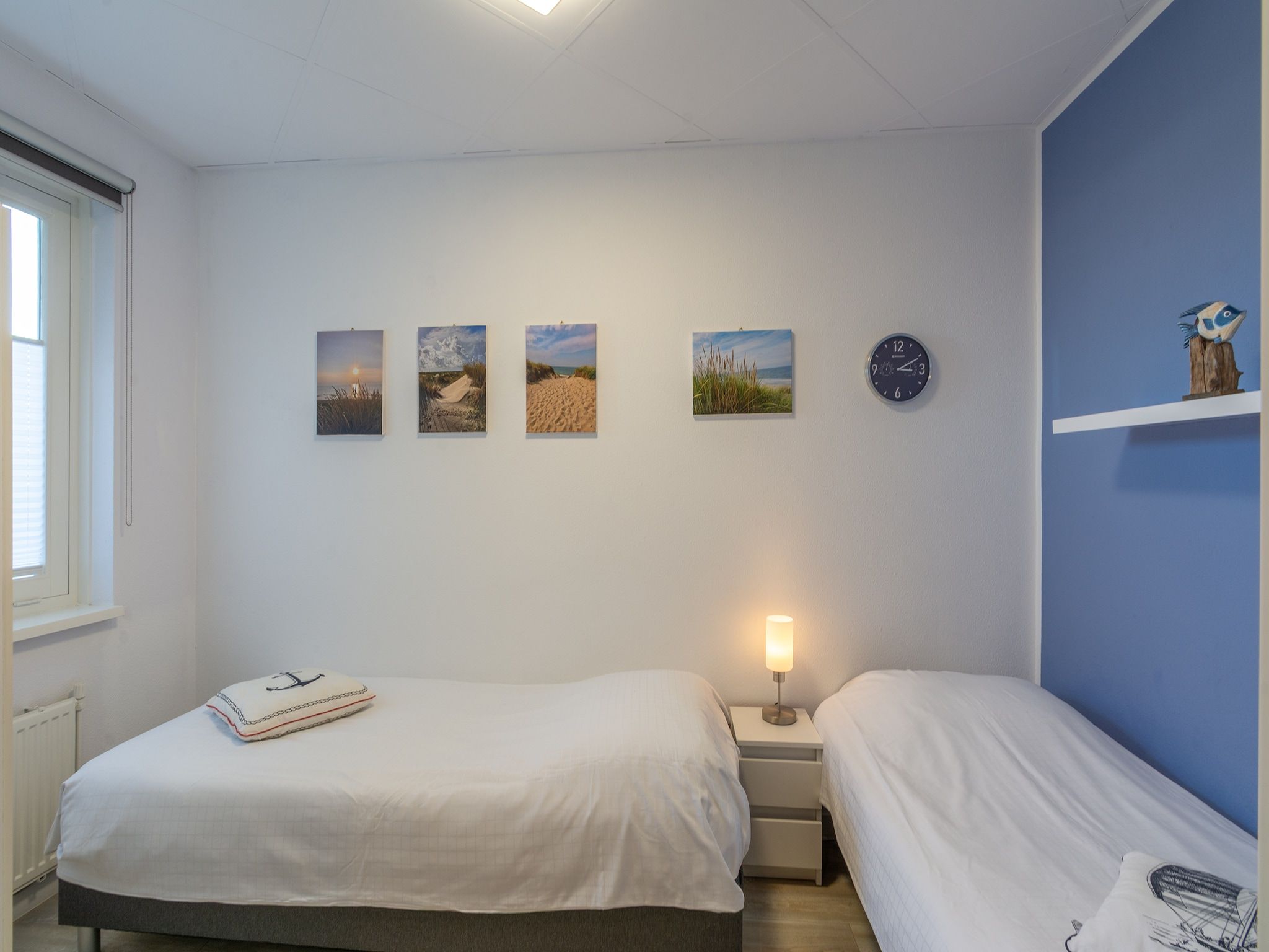 Een slaapkamer van Strandslag 103 in Julianadorp aan Zee