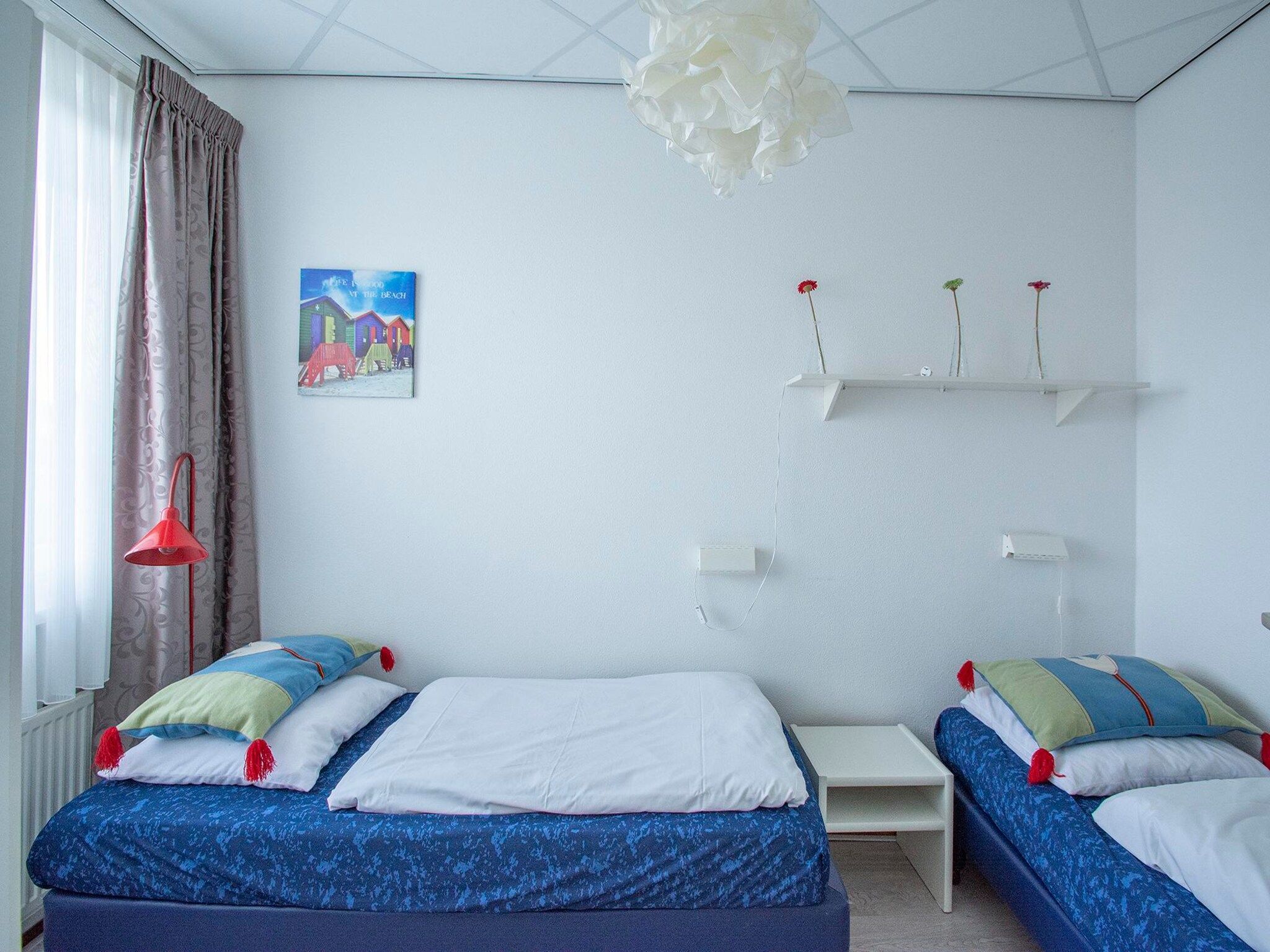 Een slaapkamer van Strandslag 107 in Julianadorp aan Zee