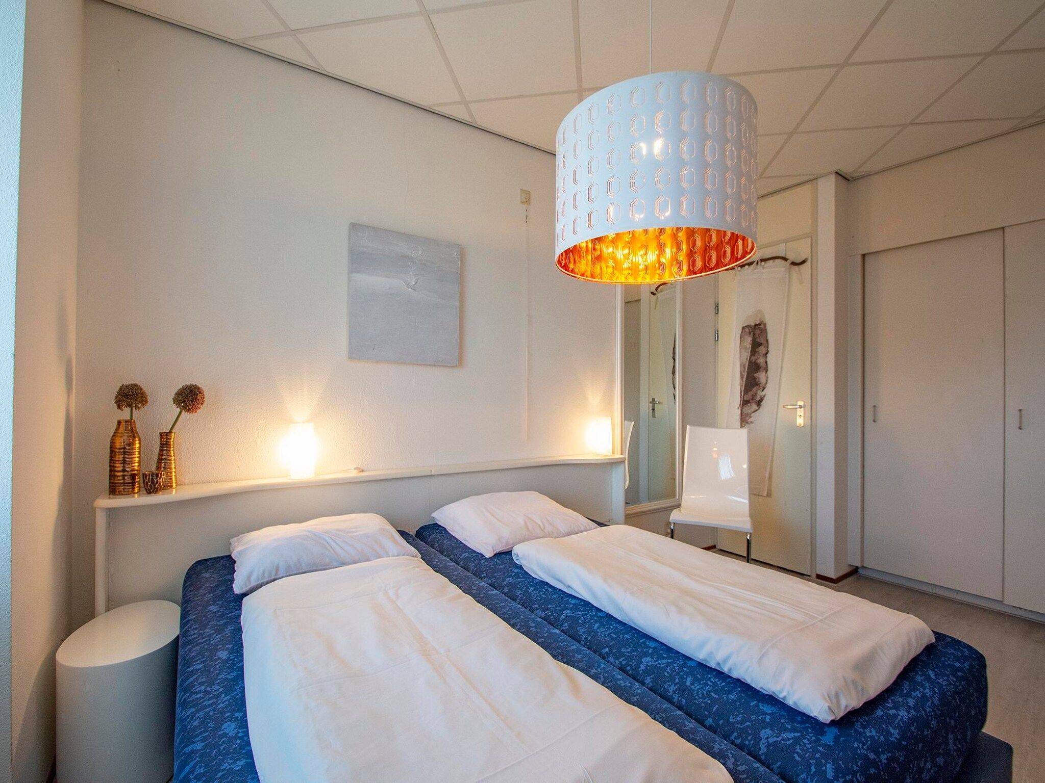 Een slaapkamer van Strandslag 107 in Julianadorp aan Zee