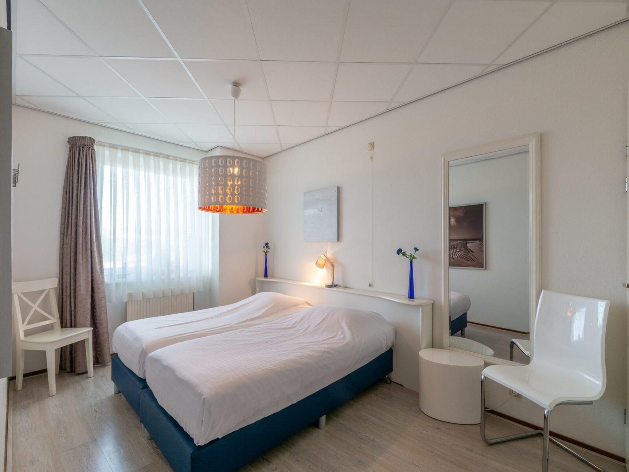Een slaapkamer van Strandslag 107 in Julianadorp aan Zee
