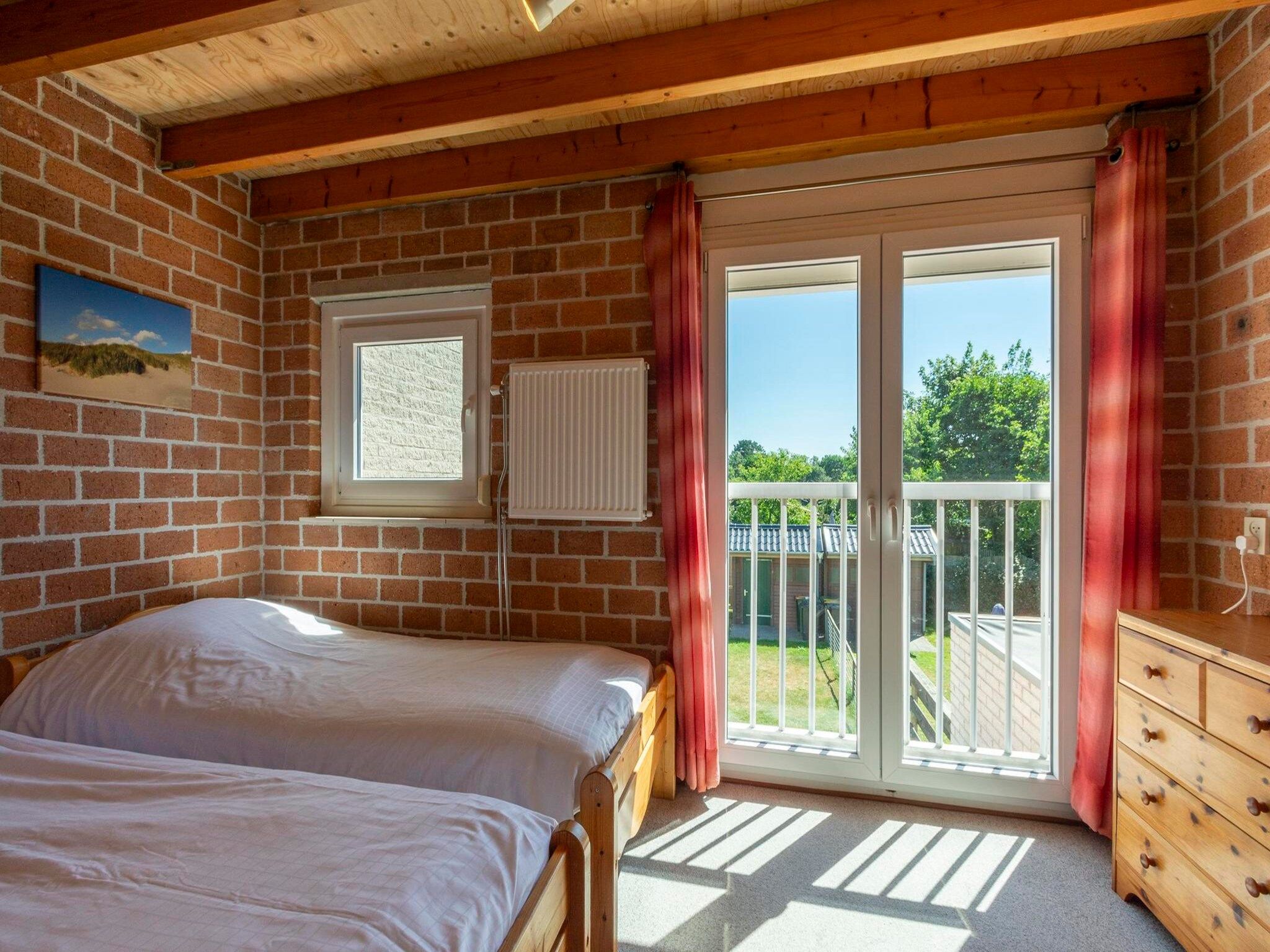 Een slaapkamer van Abbestederweg 24A in Callantsoog