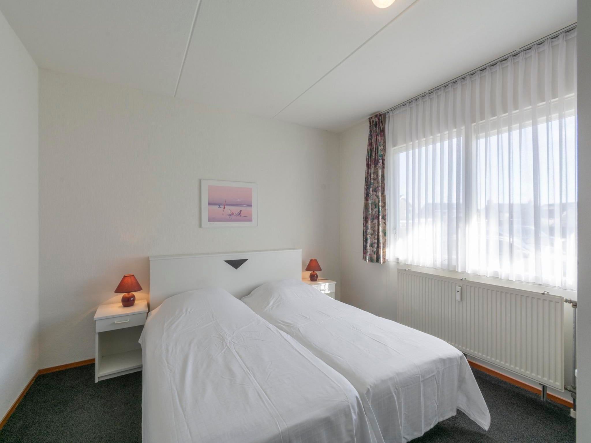 Een slaapkamer van Beach Appartement 05 in Callantsoog