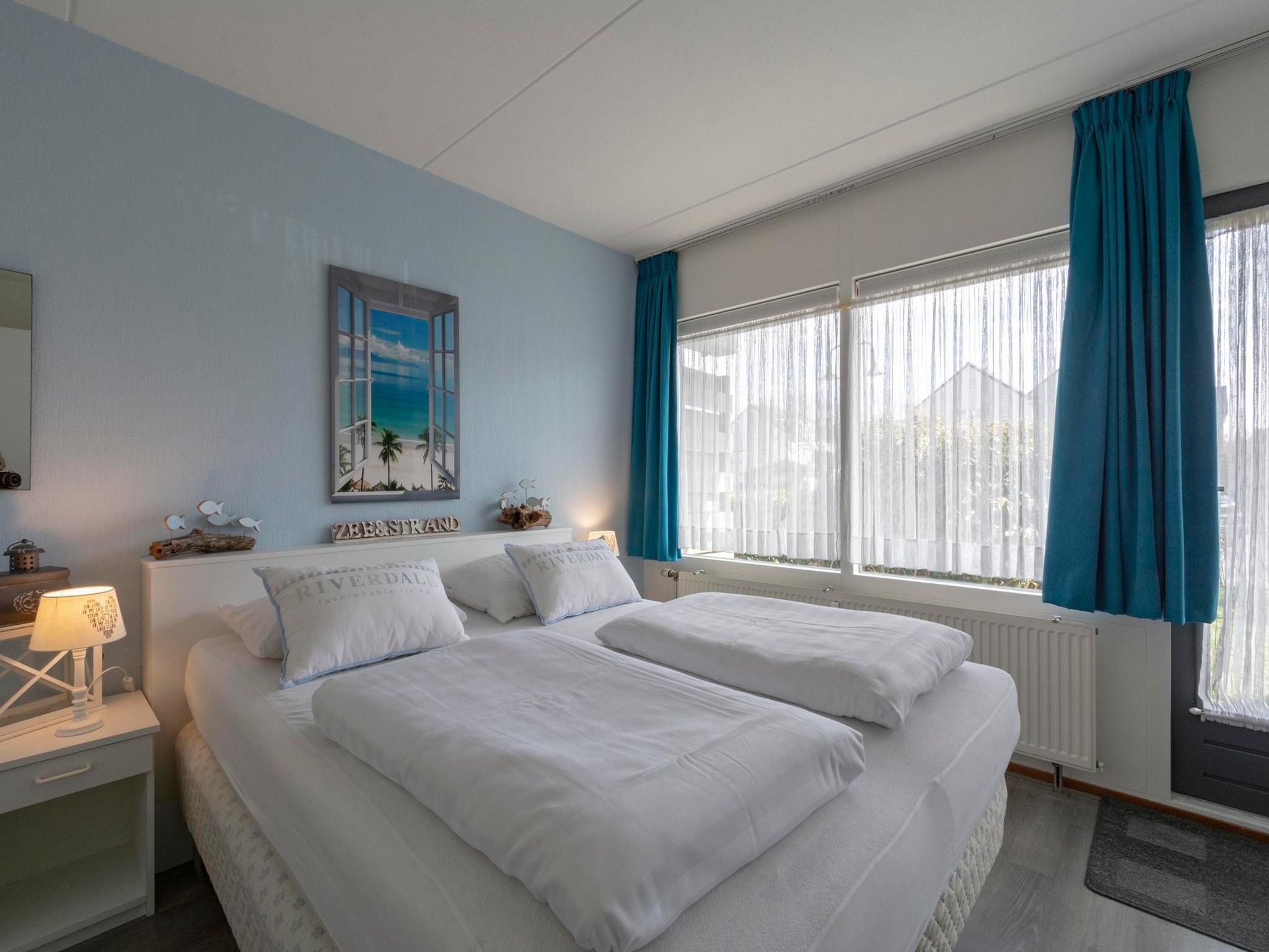 Een slaapkamer van Beach Appartement 11 in Callantsoog