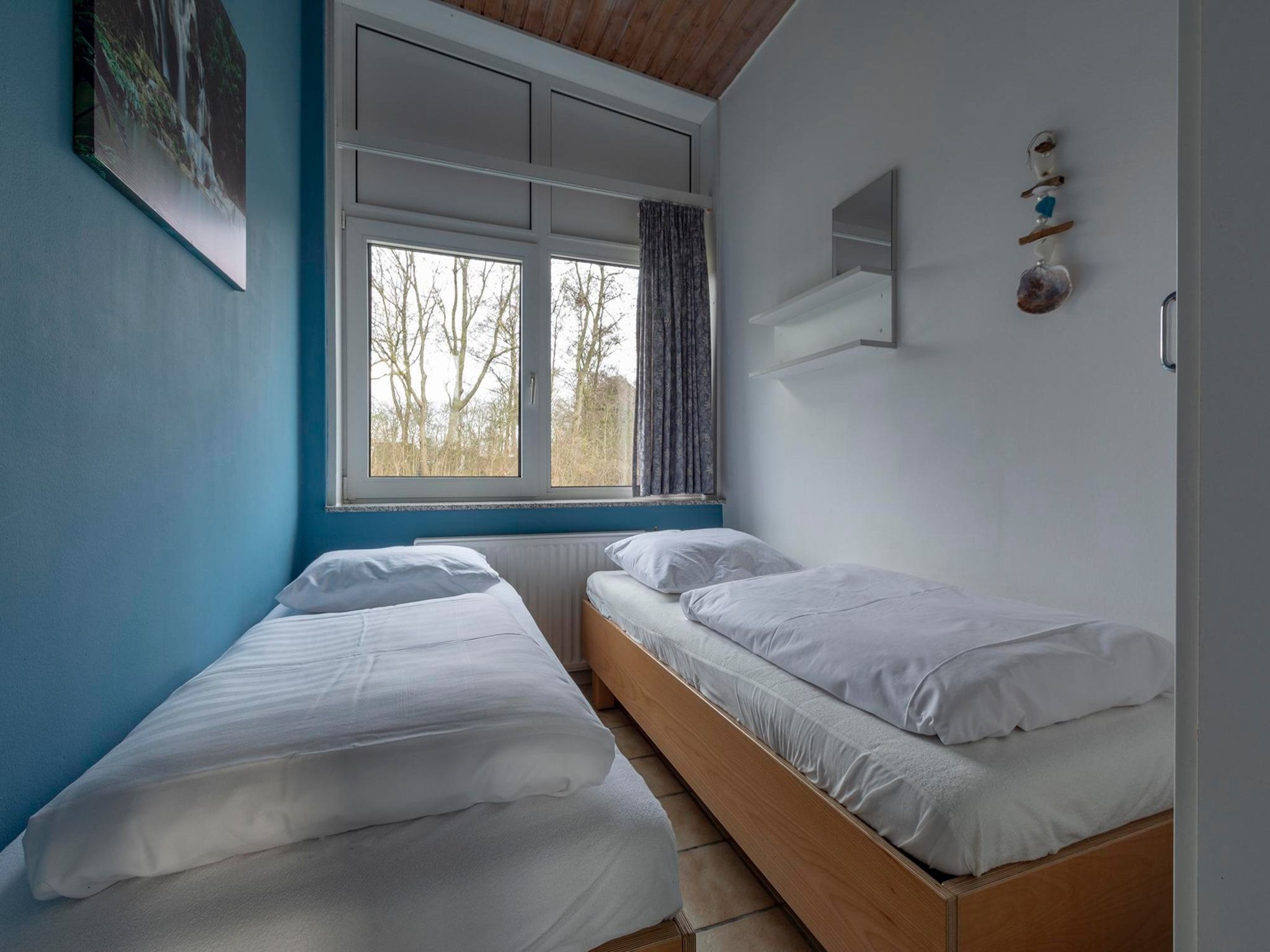Een slaapkamer van Duinland XL in Sint Maartenszee