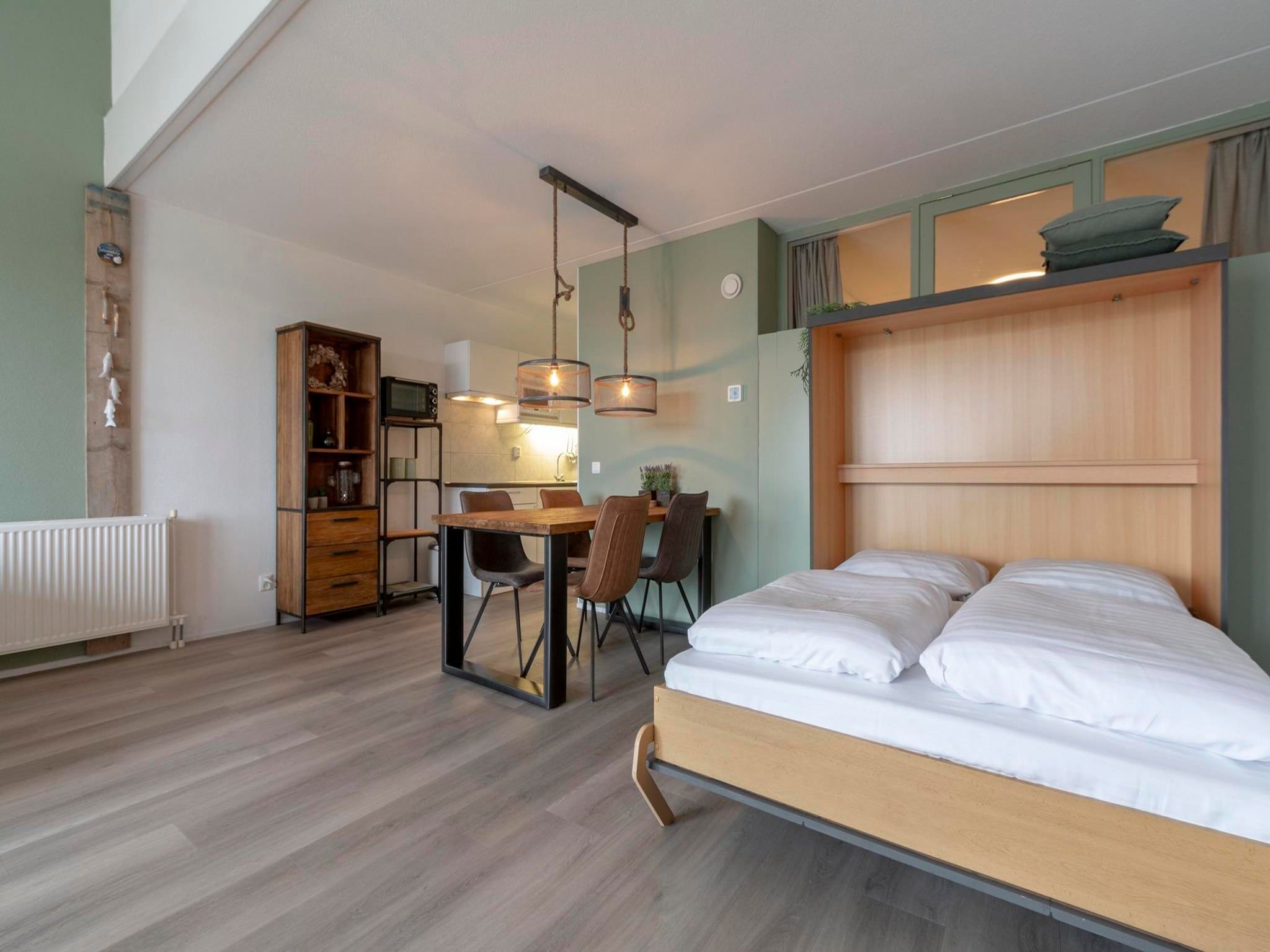 Een slaapkamer van Strandslag 203 in Julianadorp aan Zee