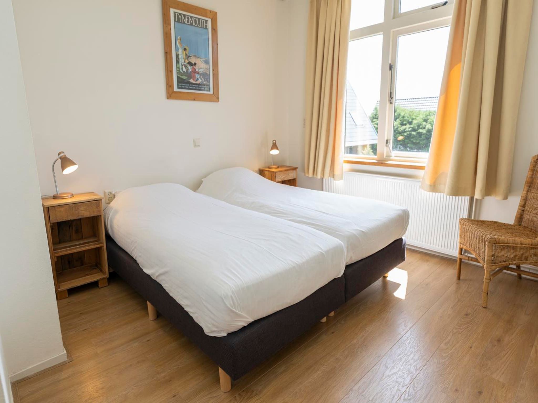 Een slaapkamer van Strandhuys Mossel in De Koog