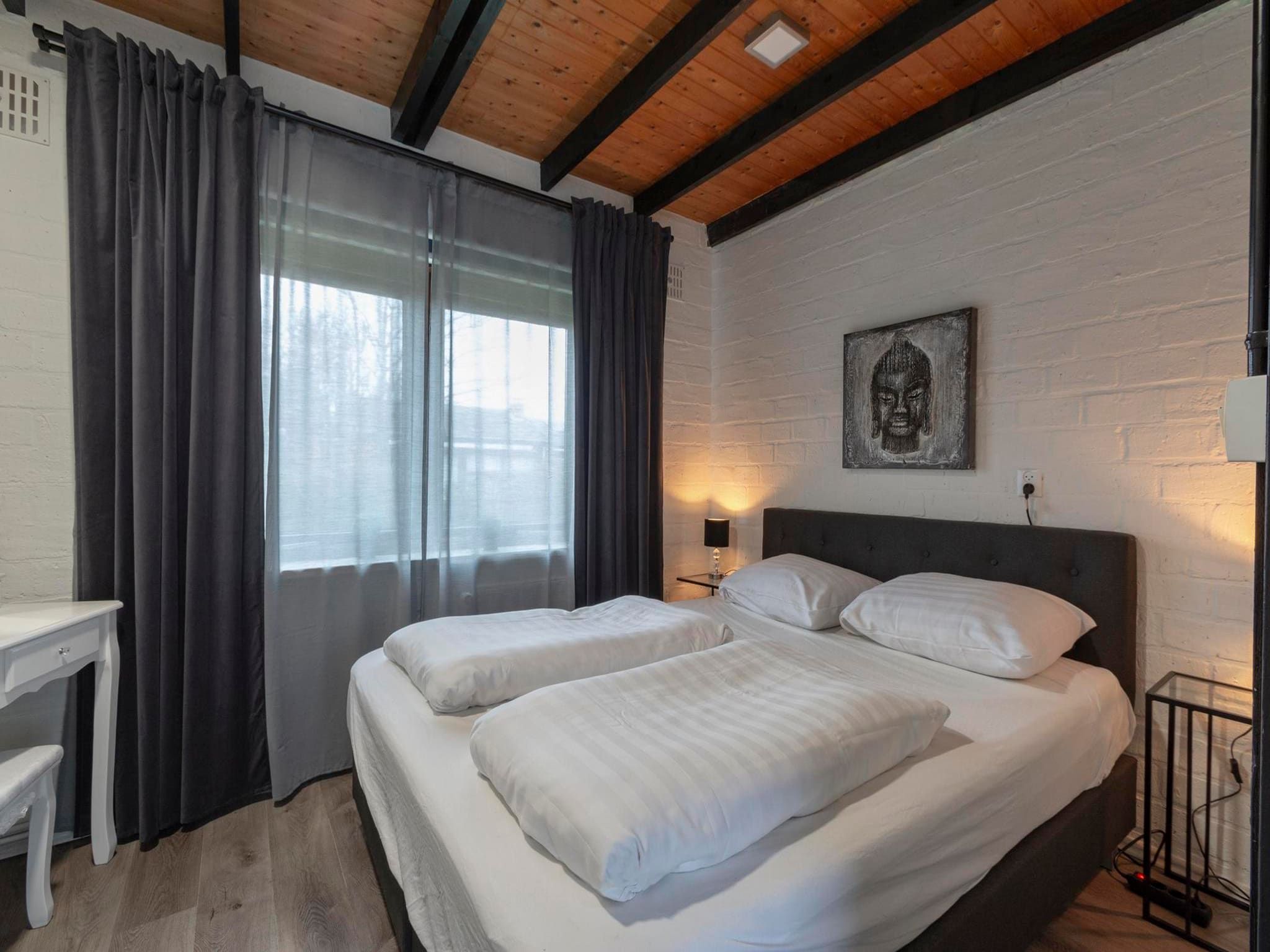 Een slaapkamer van Boerenslag 2 in Sint Maartenszee
