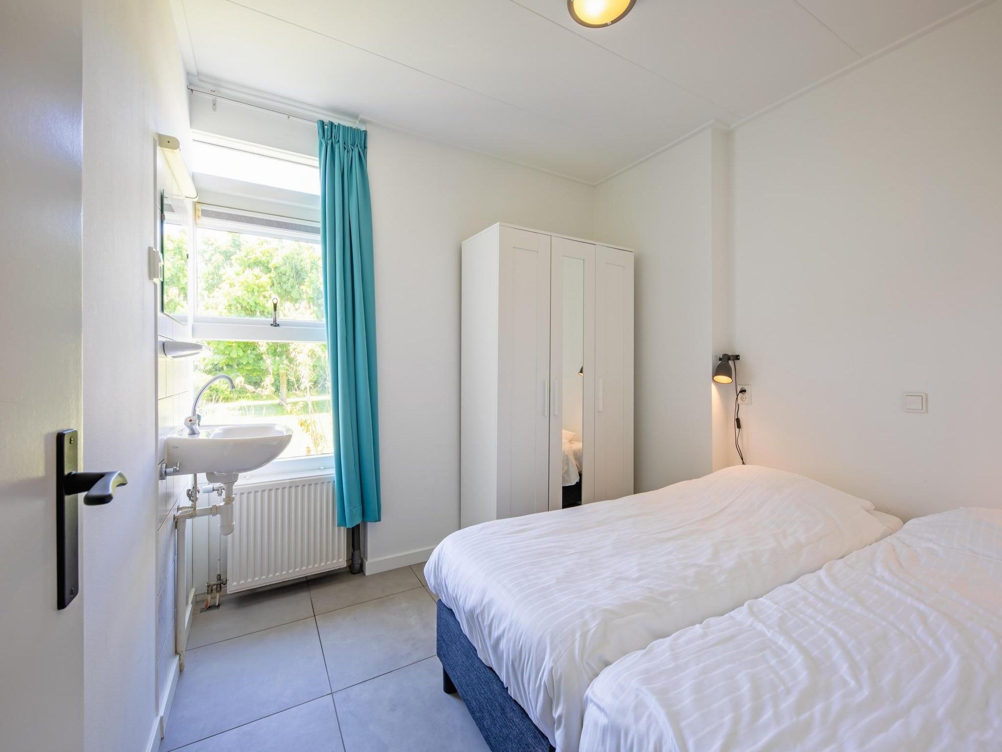 Een slaapkamer van Strandhuys Oester in De Koog
