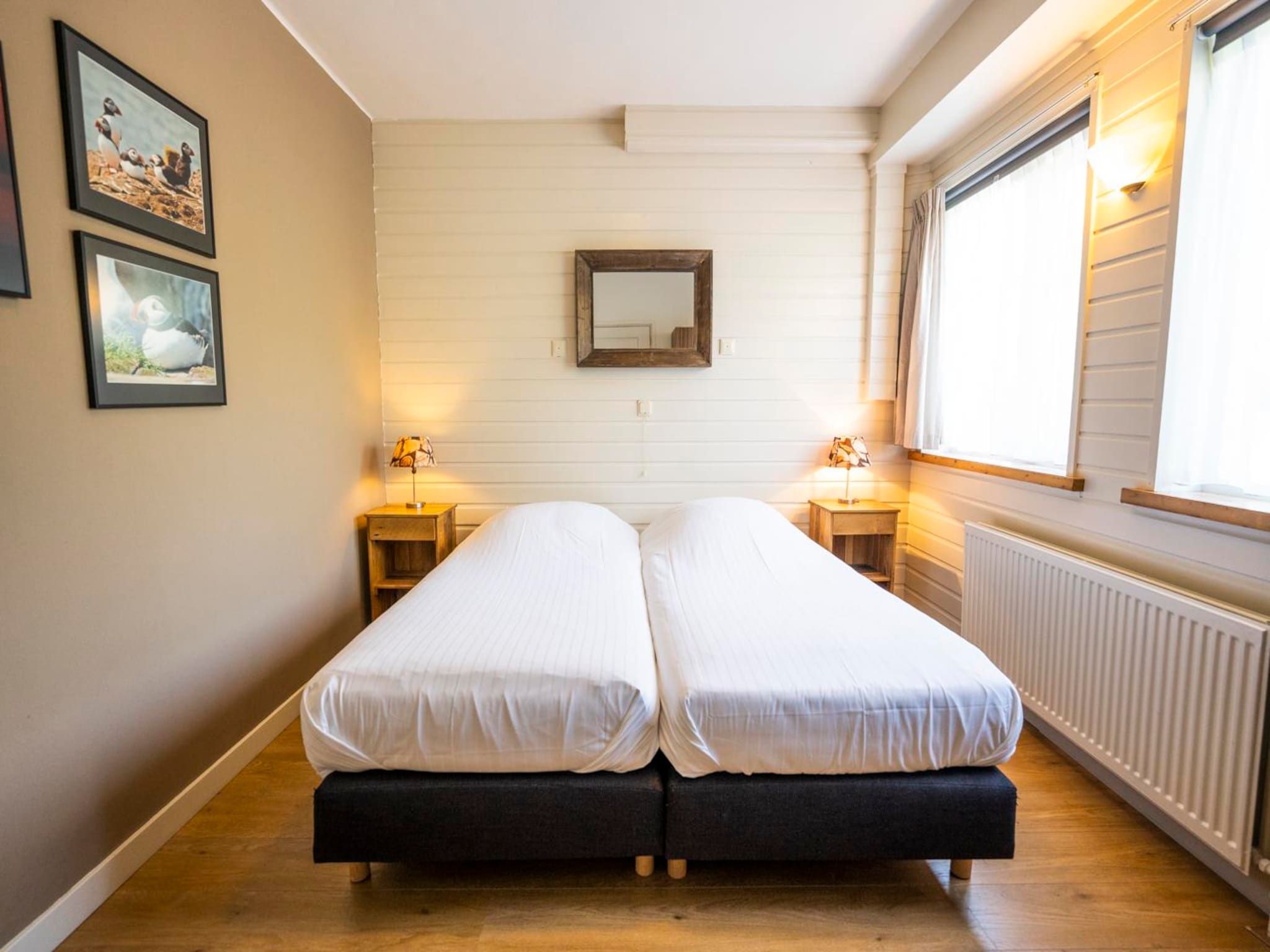 Een slaapkamer van Strandhuys Schelp in De Koog