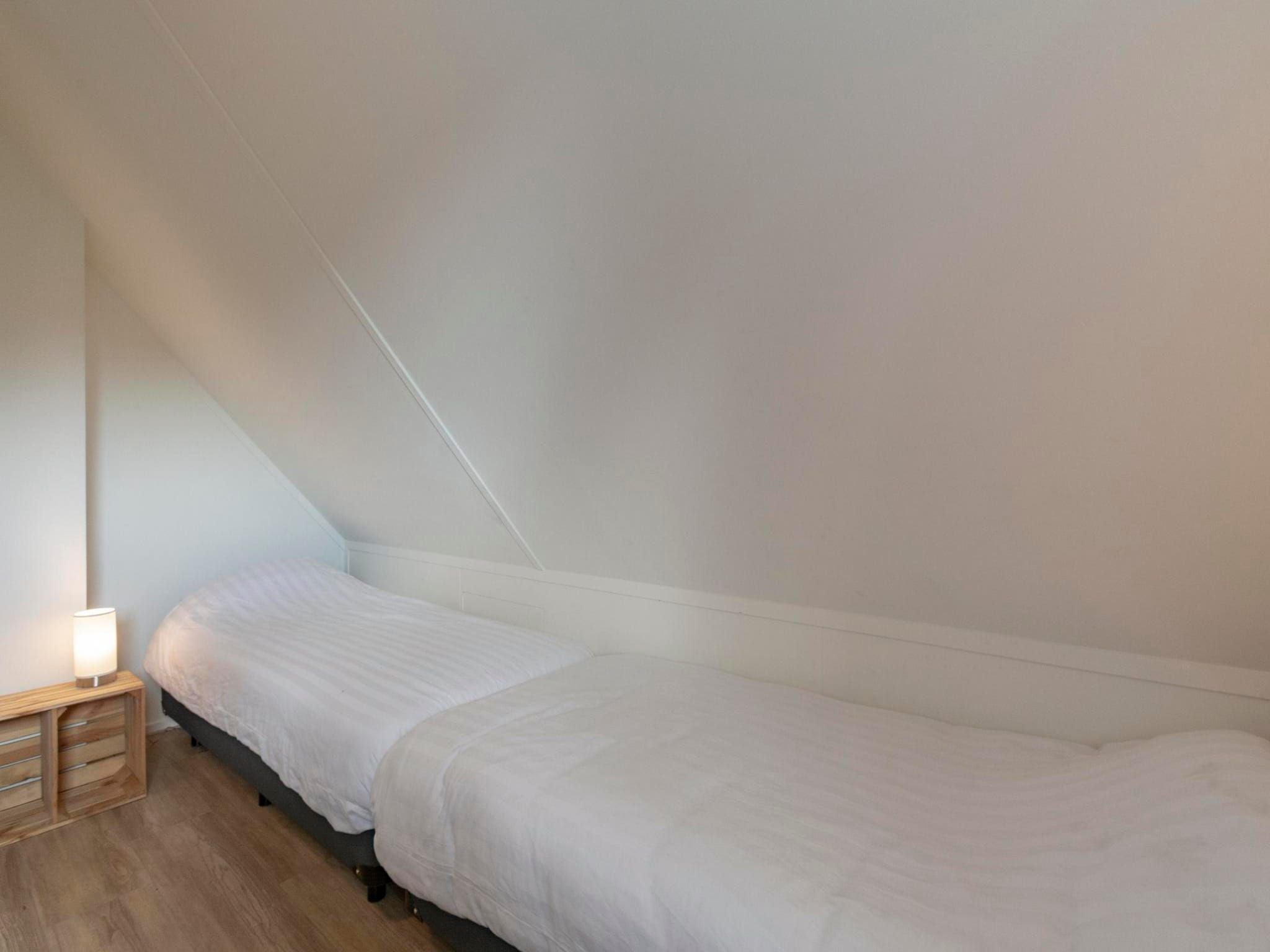 Een slaapkamer van Duynopgangh 16 in Julianadorp aan Zee