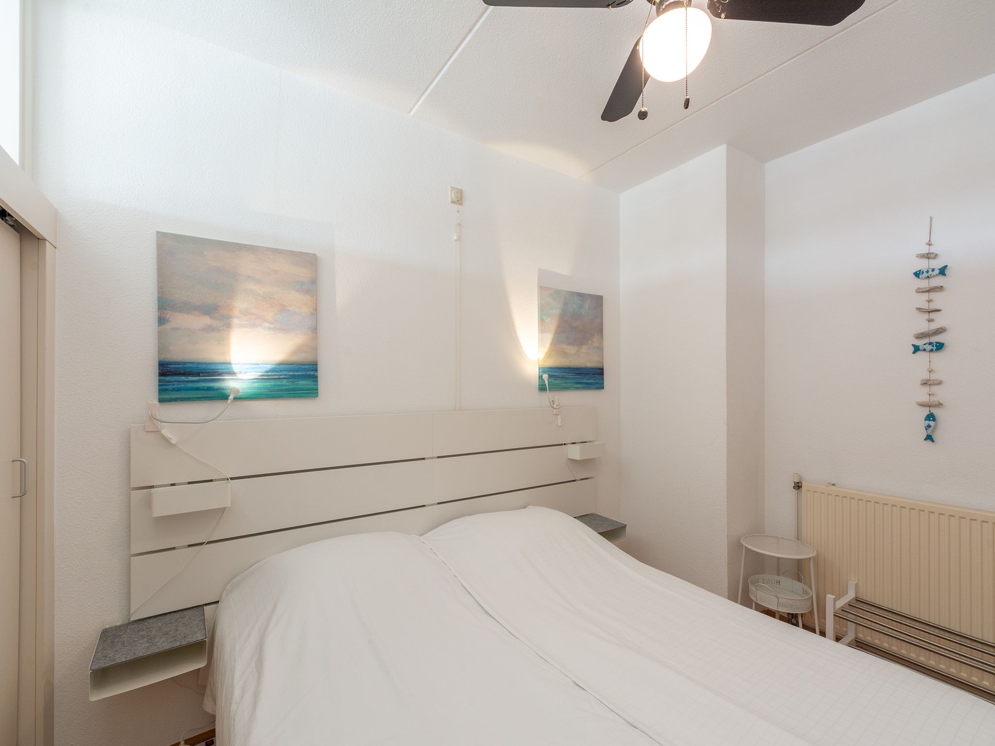 Een slaapkamer van Strandslag 225 in Julianadorp aan Zee