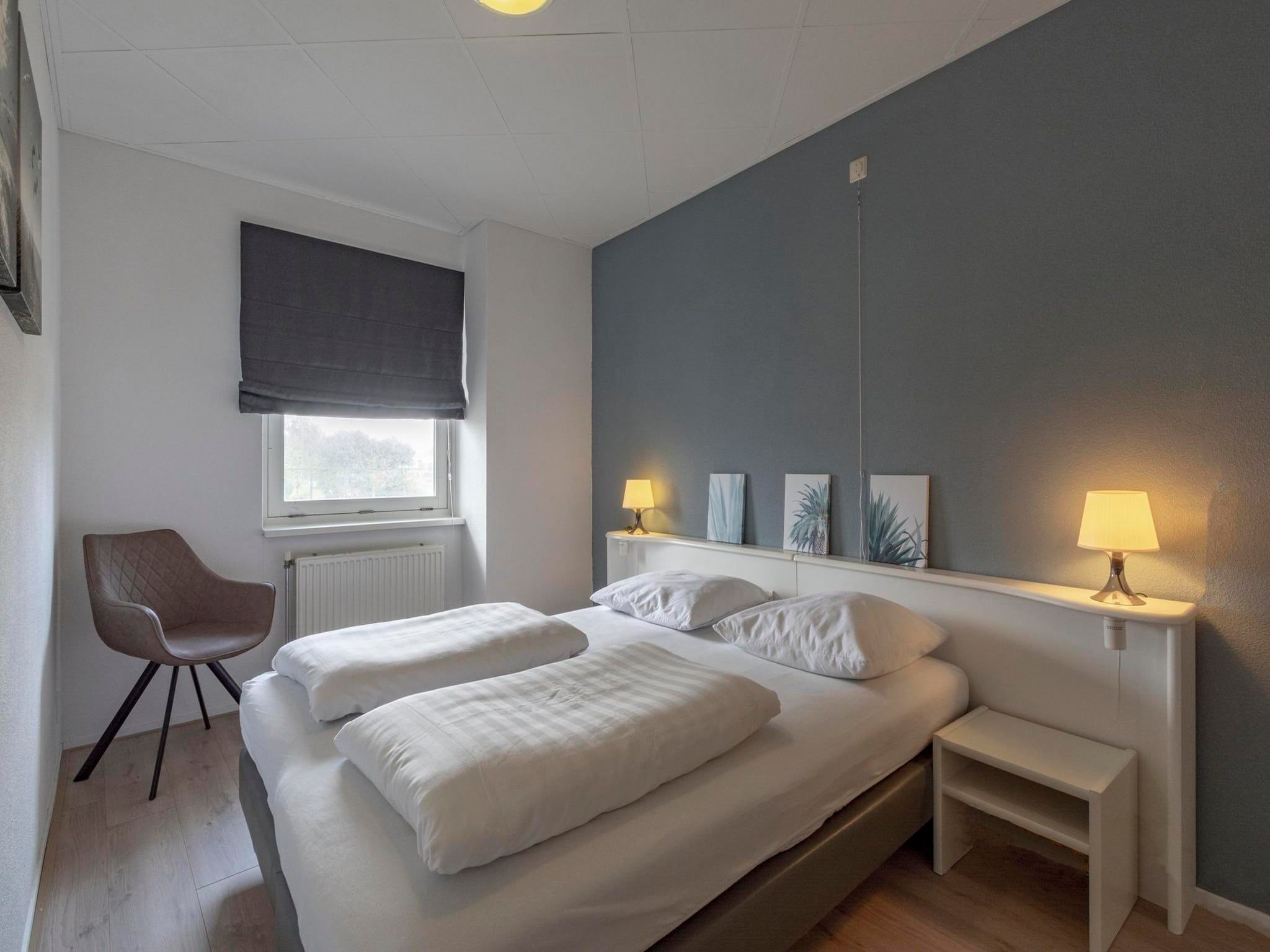 Een slaapkamer van Strandslag 95 in Julianadorp aan Zee