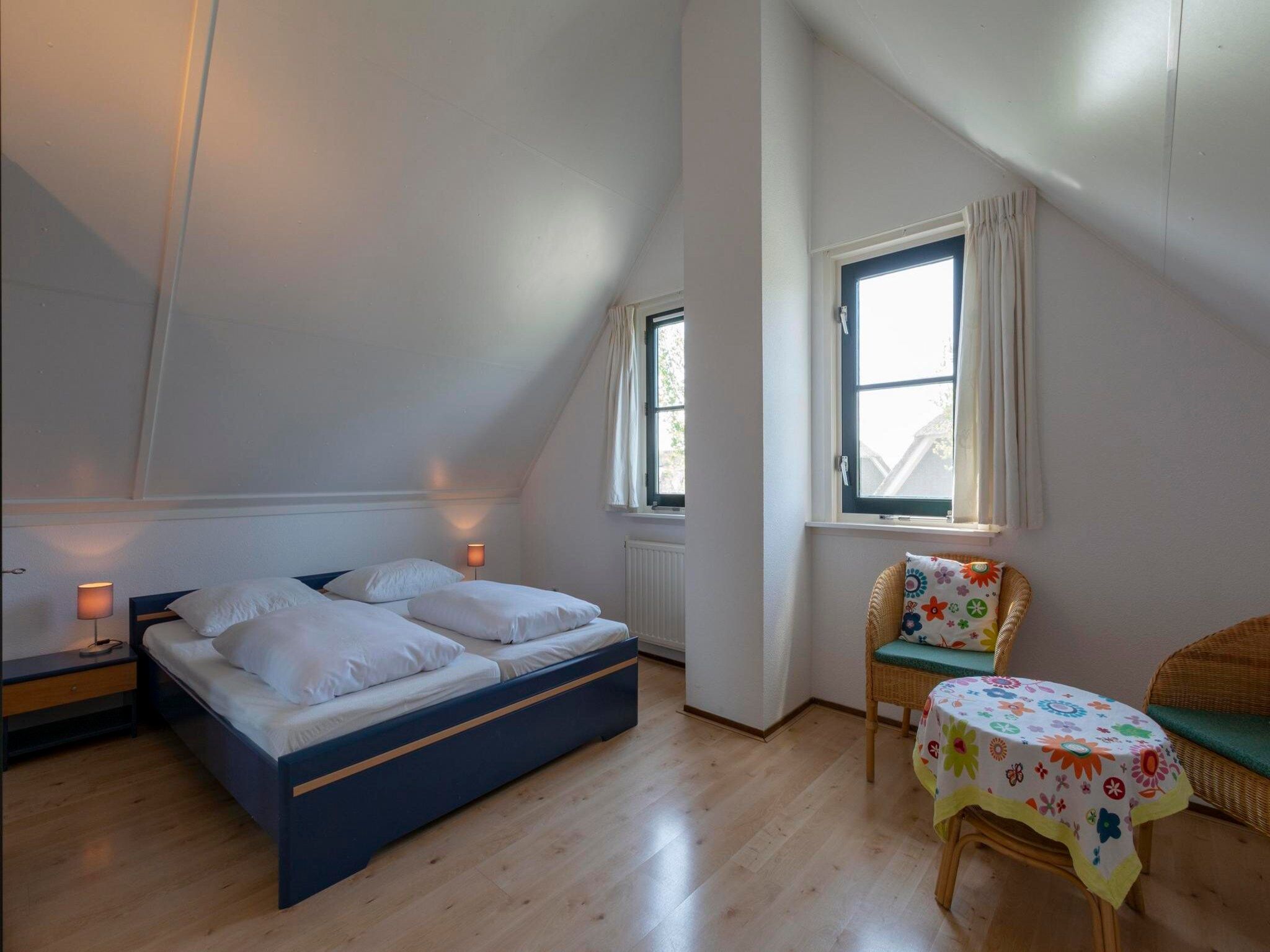 Een slaapkamer van De Buitenplaats 98 in Callantsoog