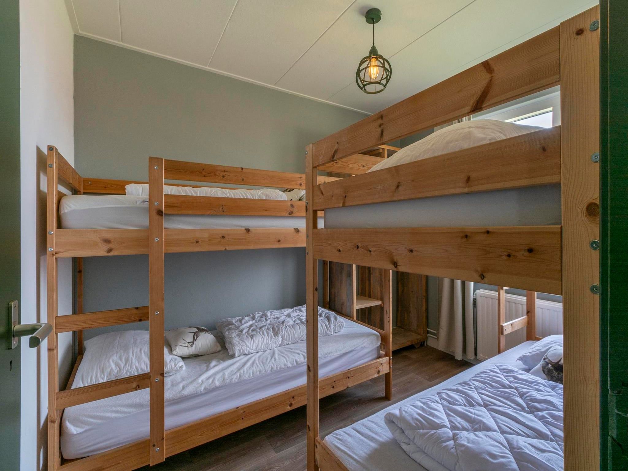 Een slaapkamer van Villa Zuidwester in Callantsoog