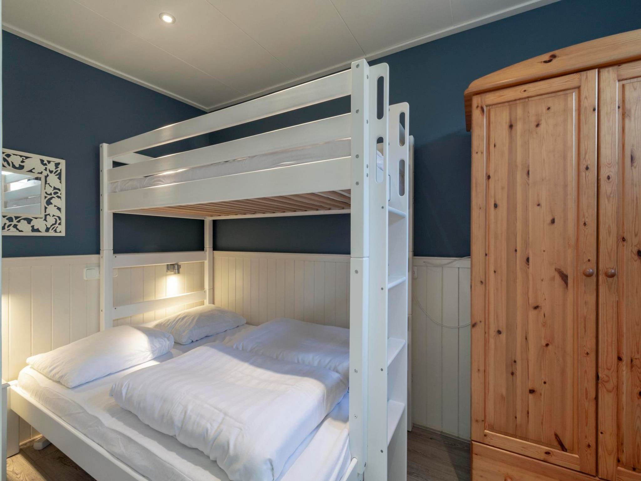 Een slaapkamer van Duinland 183 in Sint Maartenszee