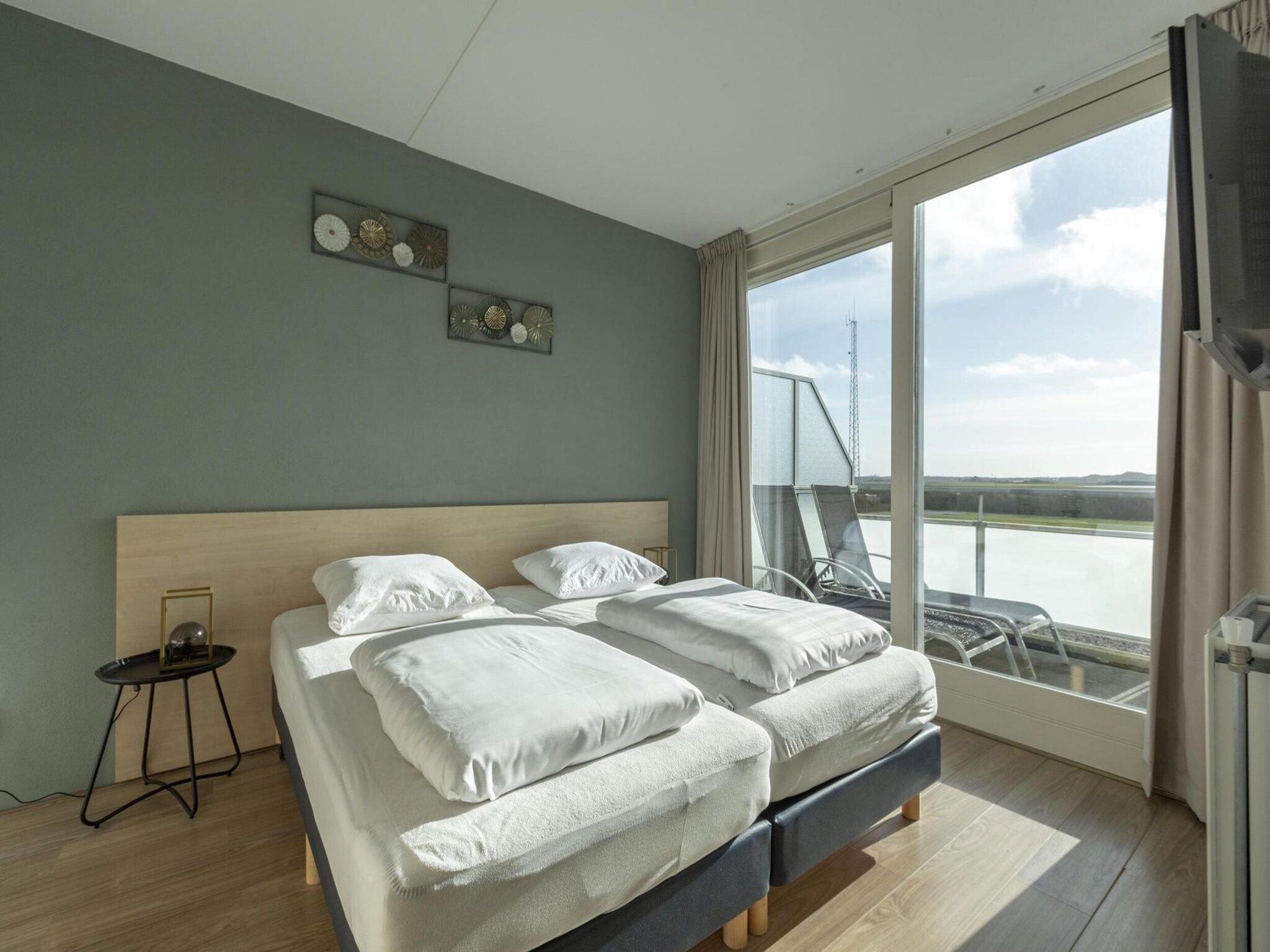 Een slaapkamer van Duinerei C202 in Groote Keeten