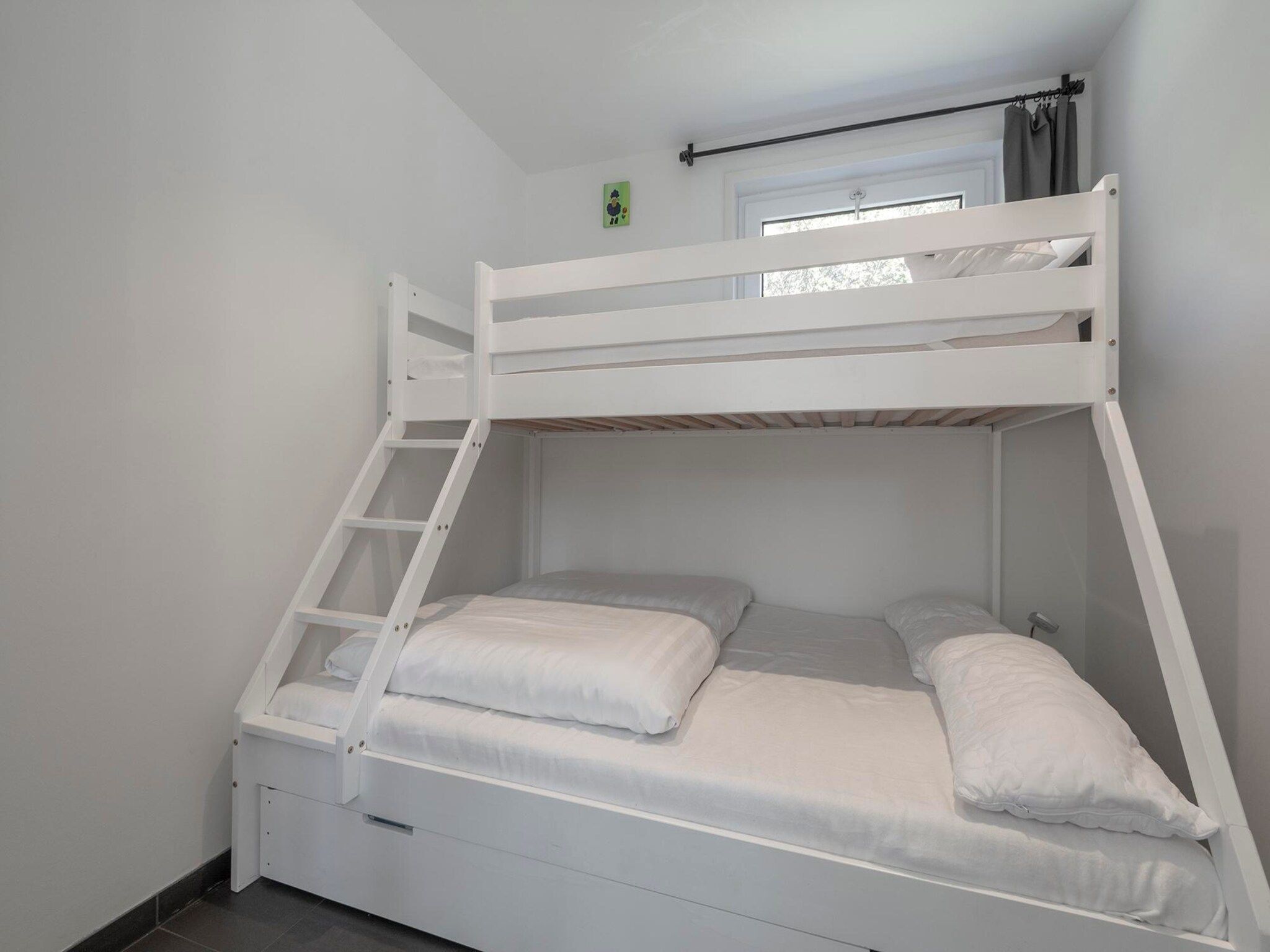 Een slaapkamer van Garnekuul 76 in Callantsoog