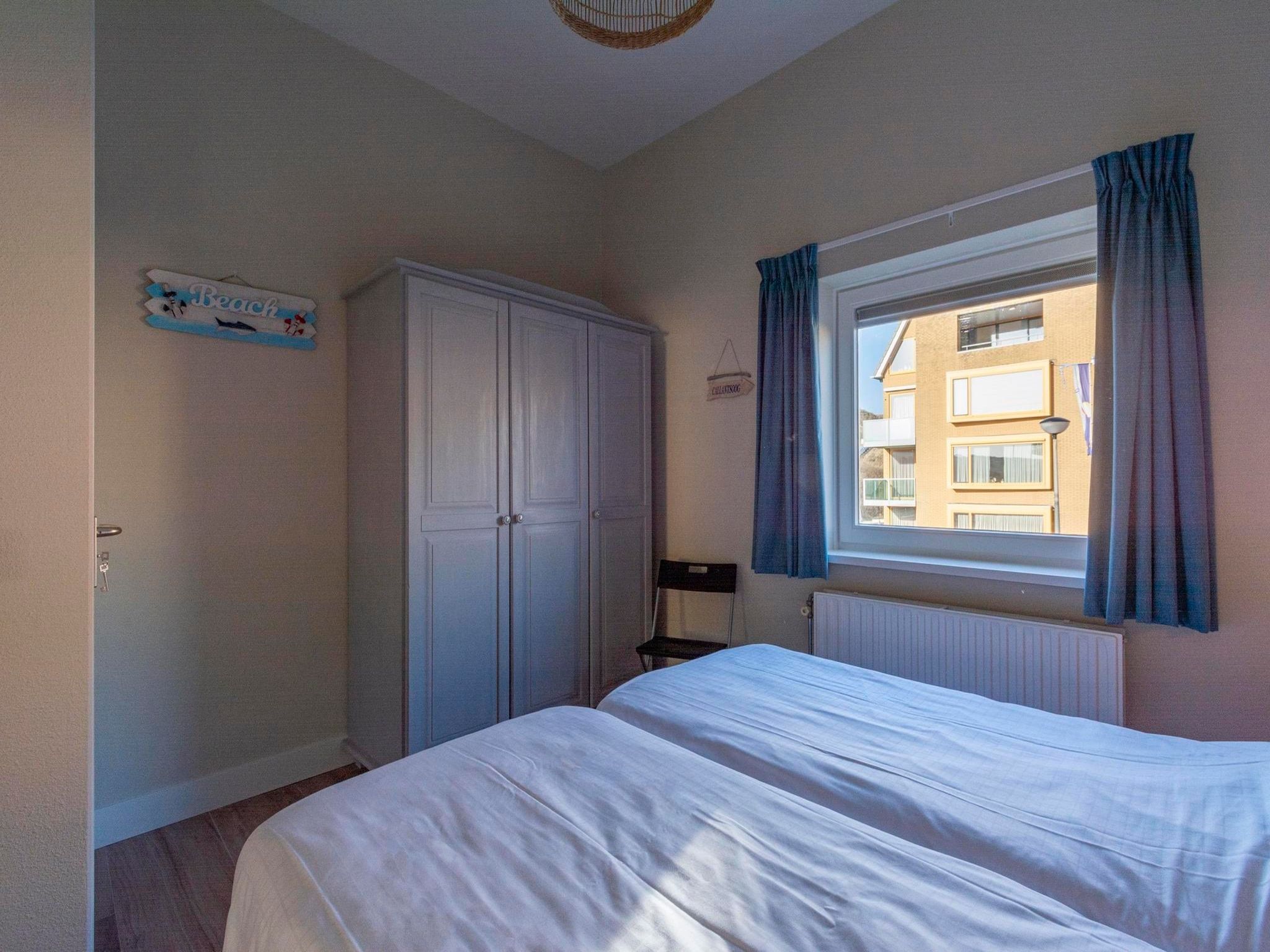 Een slaapkamer van Wijde Blick 112 in Callantsoog