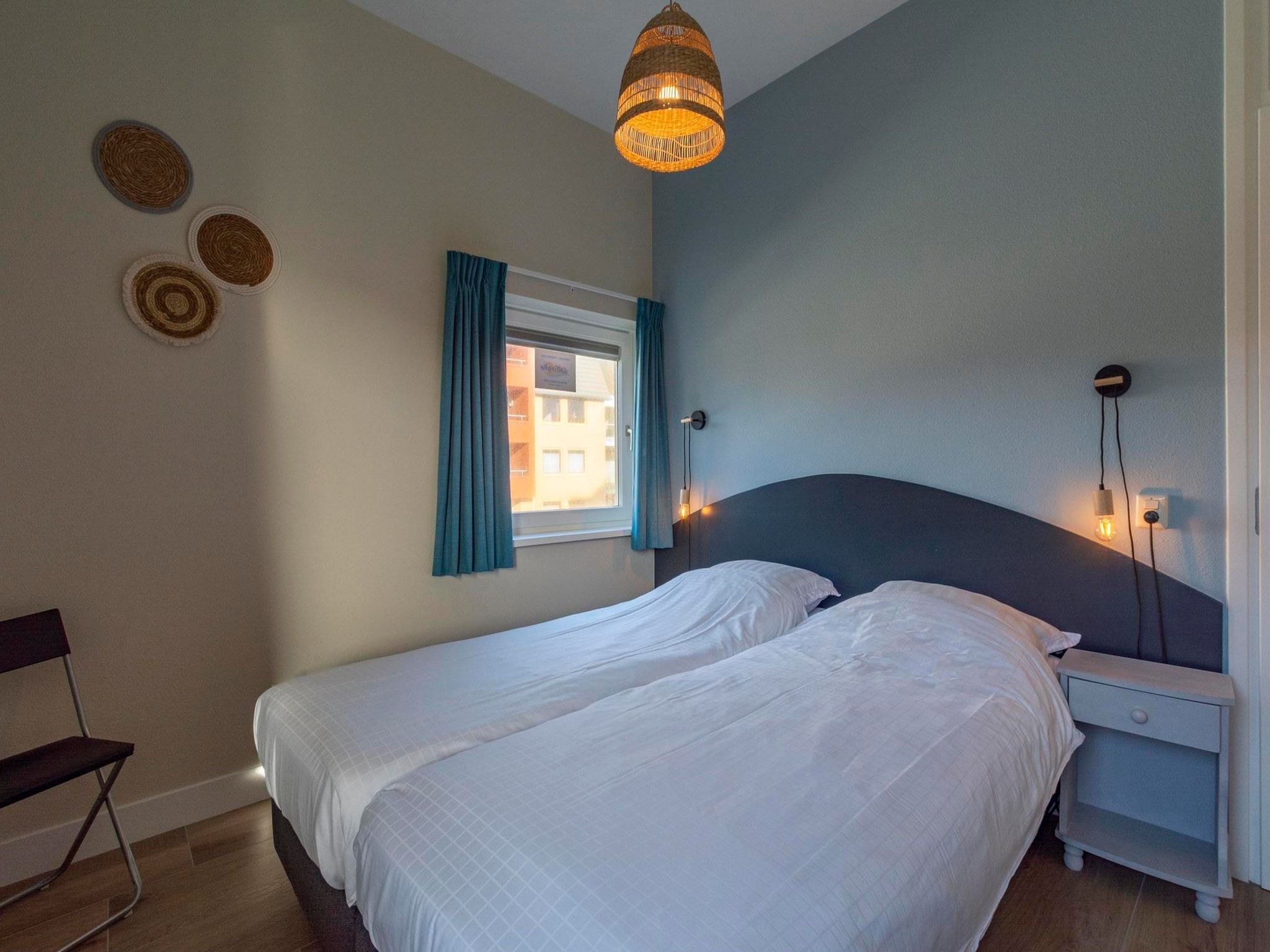 Een slaapkamer van Wijde Blick 112 in Callantsoog