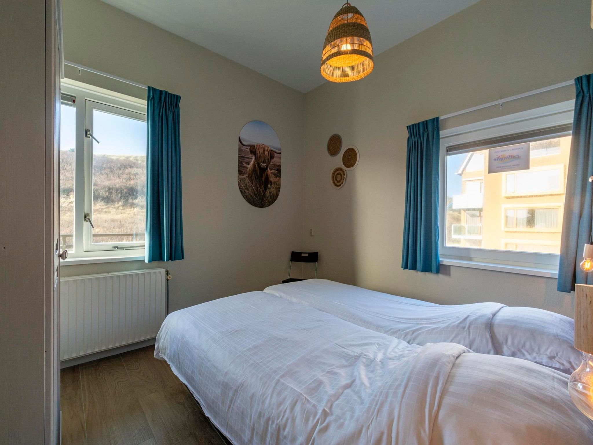 Een slaapkamer van Wijde Blick 112 in Callantsoog