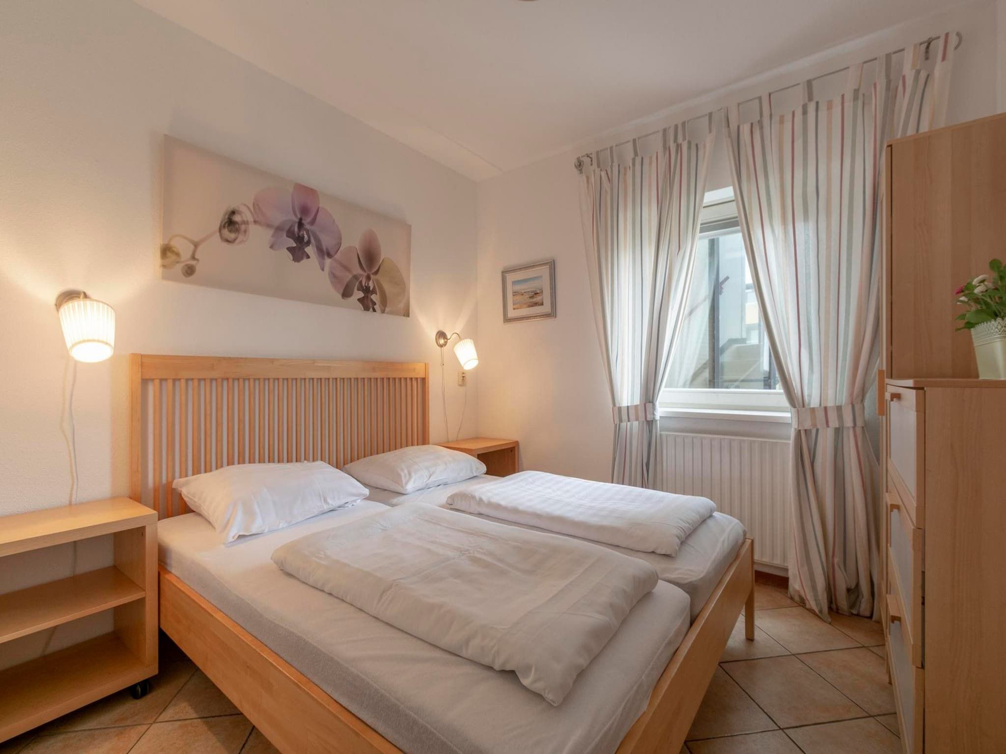 Een slaapkamer van Wijde Blick 201 in Callantsoog