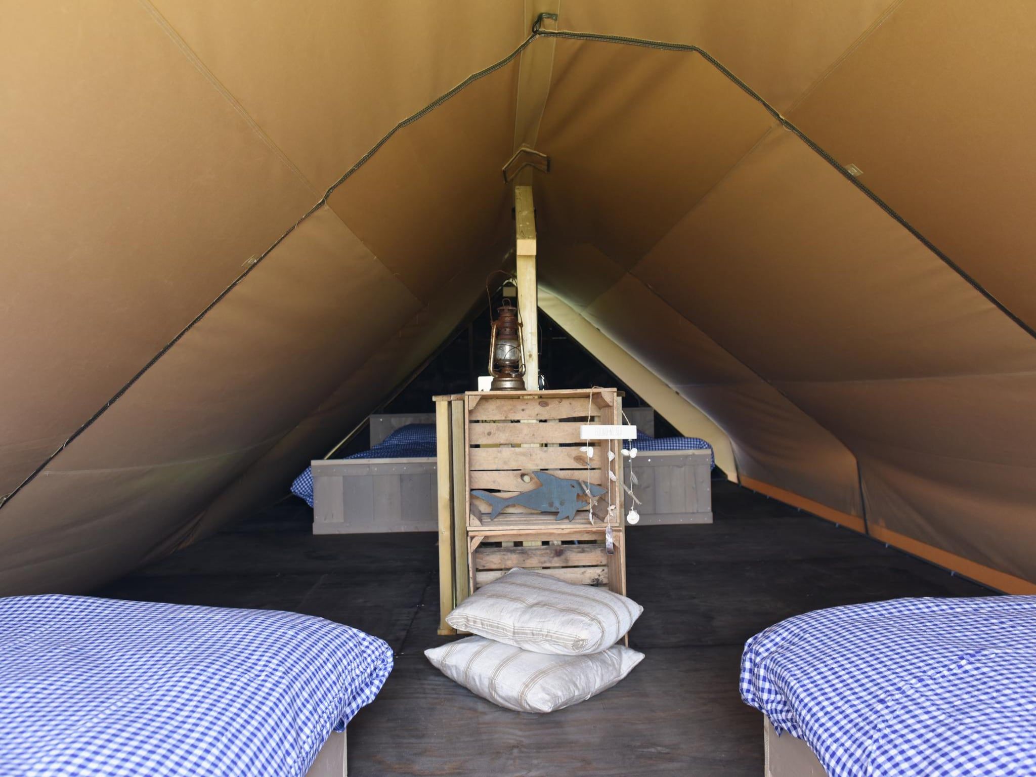 Een slaapkamer van Beach Lodge Luxe - Duynpark in Callantsoog