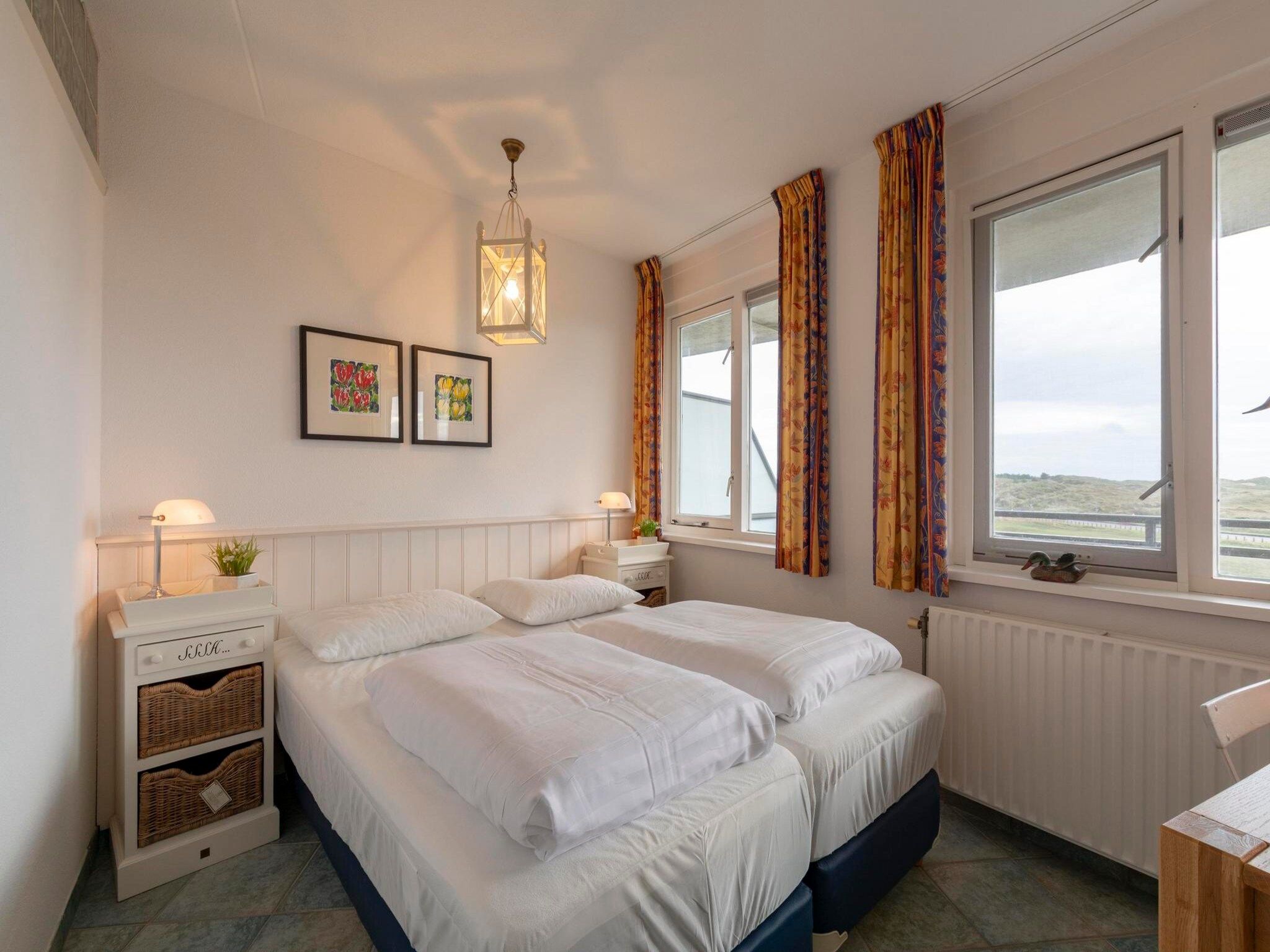 Een slaapkamer van Wijde Blick 206 in Callantsoog