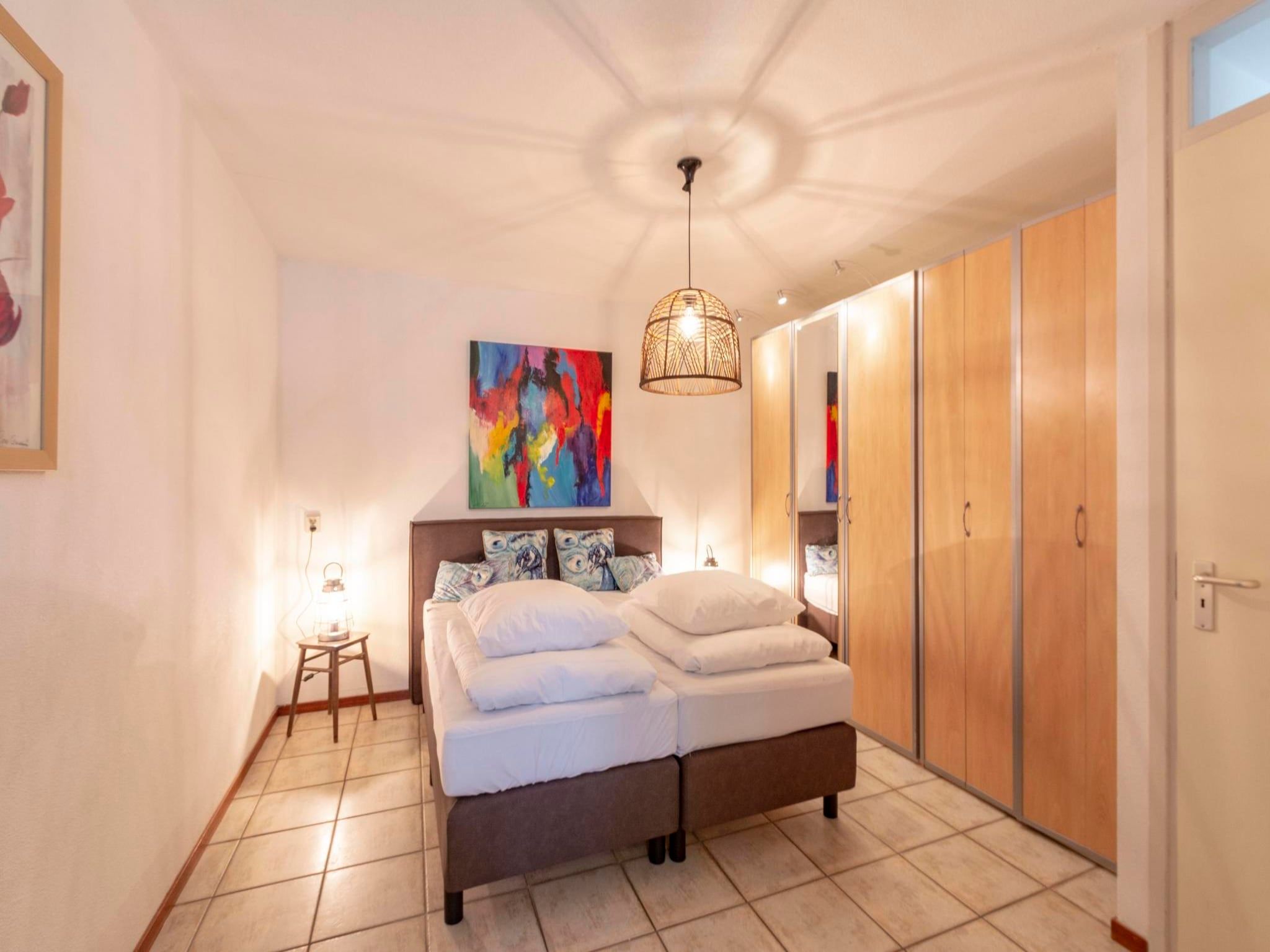 Een slaapkamer van Wijde Blick 210 in Callantsoog